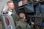 Donovan Benzin became a Guard member for a day at the 107th Airlift Wing, Niagara Falls Air Reserve Station. Air Force Lt. Col. Gregory Miller showed Donovan how to fly a C-130 aircraft on a simulator.