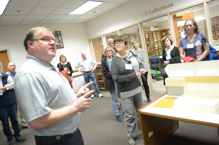 Jim Ginther, archives team leader in the Archives and Special Collections Branch at Marine Corps University, talks to graduates of Quantico High School about the Marine Corps Base Quantico archives on Oct. 30. The graduates toured the base as part of their all-years reunion.