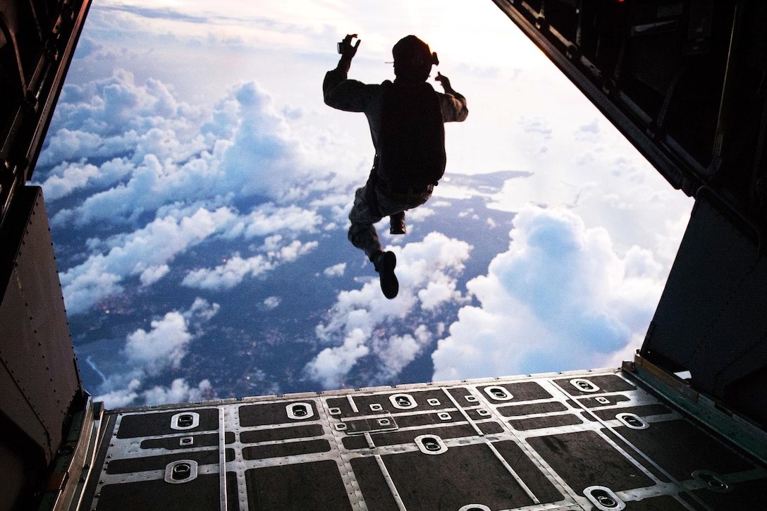 U.S. Navy Petty Officer 1st Class Nelson Cothren performs a free fall jump from a C-130 Hercules during military free fall jump sustainment training in Santa Rita, Guam, Nov. 4, 2015. U.S. Navy photo by Petty Officer 1st Class Ace Rheaume