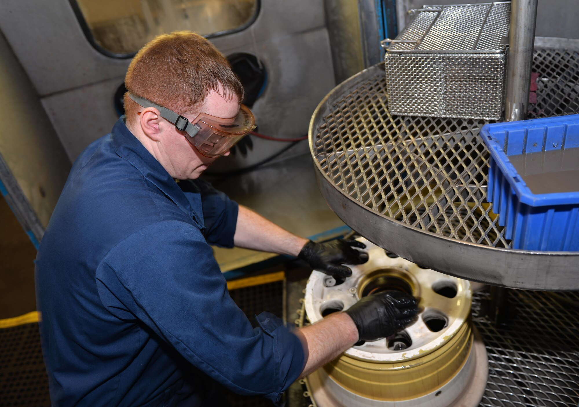 Senior Airmen Kenneth Chandler, 33rd Maintenance Squadron crew chief, cleans the wheel of an F-35A Lightning II at Eglin Air Force Base, Fla., Nov. 4, 2015. The wheel and tire back shop cleans the wheels to prevent corrosion when they are brought in to be serviced. (U.S. Air Force Photo/Senior Airman Andrea Posey)