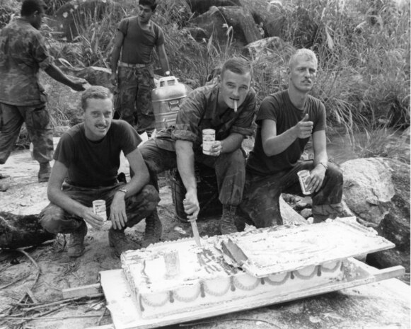 1st Lt. Raymond Horn, Charlie Company 1/7, 1st Marine Division, commanding officer, cuts a piece of cake to celebrate the Marine Corps Birthday birthday n Vietnam in 1969.