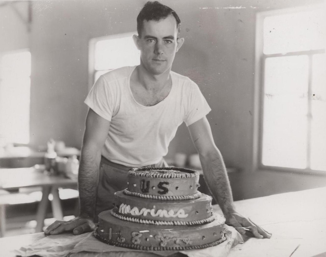 Field Cook Dewitt Waite with Marine Corps Birthday Cake, 1943 
"Baked 168th Birthday Cake for Bermuda Marines: Marine Field Cook Dewitt M. Waite, RFD 2, Adams, New York, is shown with the cake he baked for the Marine 168th Birthday Anniversary, Nov. 10, 1943. Waite, who enlisted March 12, 1942, was a baker in civilian life."
 
From the Photograph Collection (COLL/3948), Marine Corps Archives & Special Collections
 
OFFICIAL USMC PHOTOGRAPH