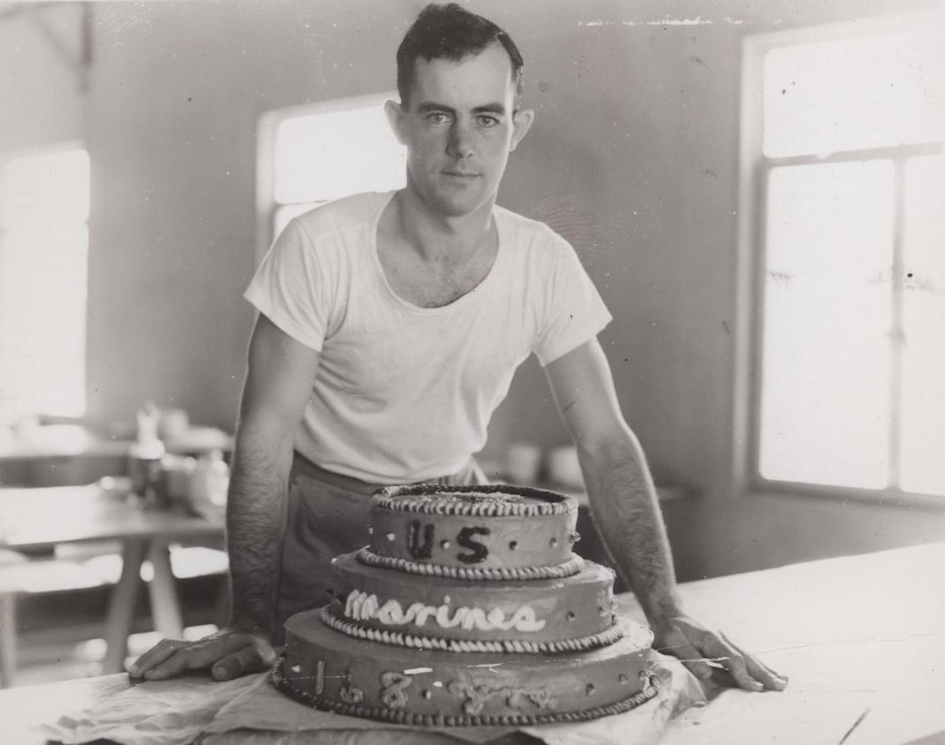 Field Cook Dewitt Waite with Marine Corps Birthday Cake, 1943 
"Baked 168th Birthday Cake for Bermuda Marines: Marine Field Cook Dewitt M. Waite, RFD 2, Adams, New York, is shown with the cake he baked for the Marine 168th Birthday Anniversary, Nov. 10, 1943. Waite, who enlisted March 12, 1942, was a baker in civilian life."
 
From the Photograph Collection (COLL/3948), Marine Corps Archives & Special Collections
 
OFFICIAL USMC PHOTOGRAPH