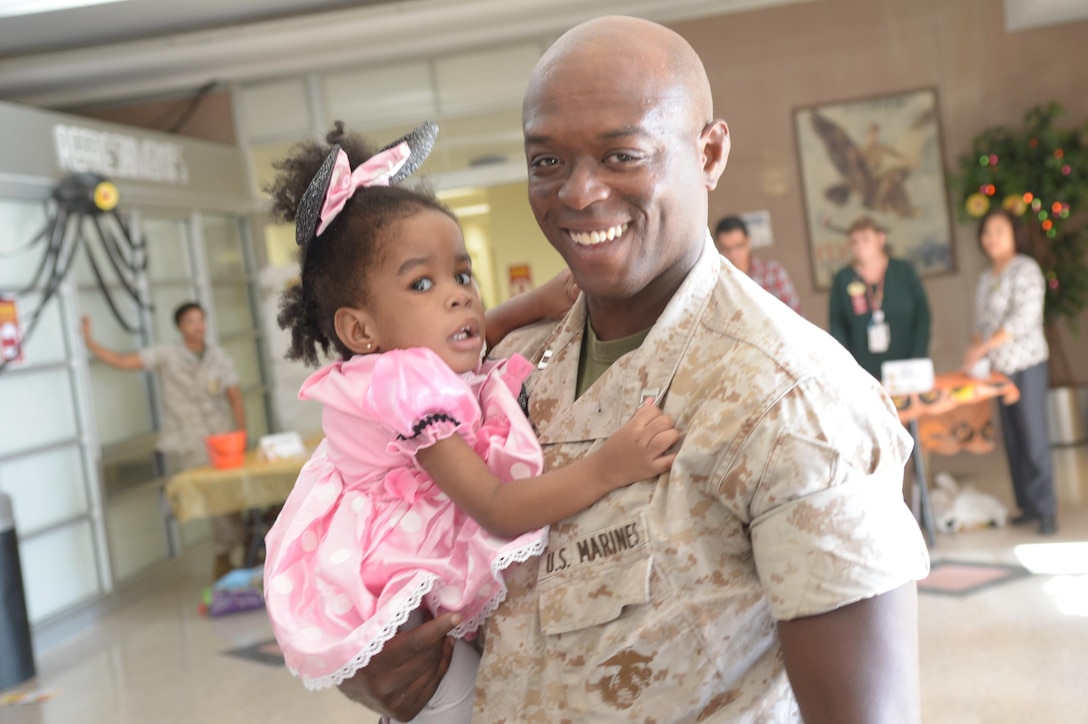 Capt. Ronnie Wilburn, Training and Education Command, with his daughter Sage, two, at the Marine Corps Community Services’s trick or treating event.