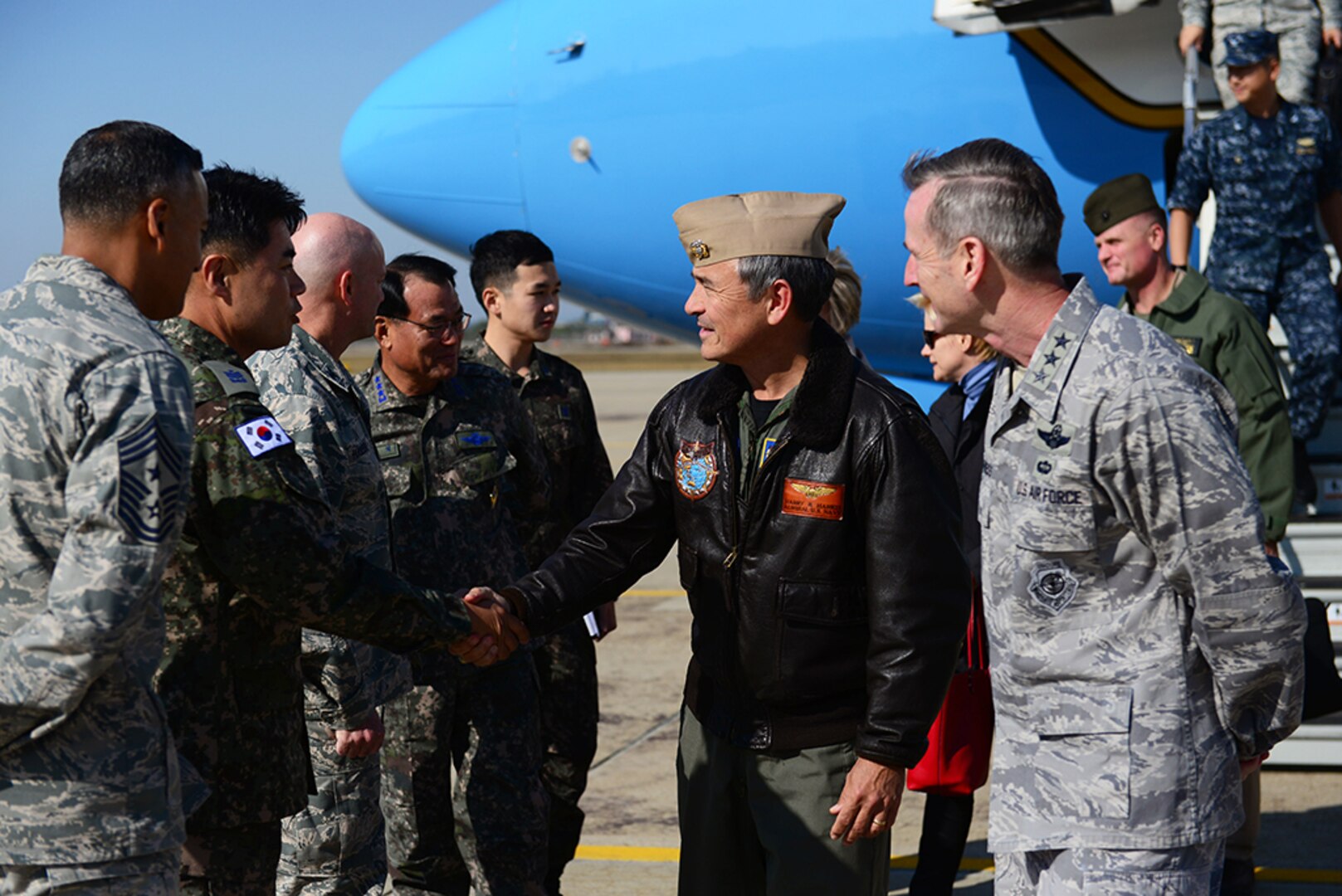 U.S. Navy Adm. Harry B. Harris Jr., U.S. Pacific Command commander, is met by U.S. and ROK senior leaders at Osan Air Base, Republic of Korea, Oct. 31, 2015. During his visit, Harris was individually briefed on the conditions of Osan’s dormitories, before inspecting one himself. In addition to this visit, he attended a series of bilateral, alliance coordination meetings between the ROK and U.S. senior leadership. 