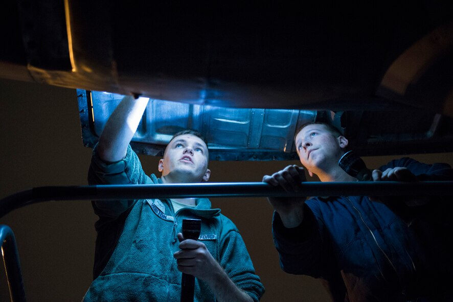 Airman 1st Class Jackson Horton and Senior Airman Michael Tielleman, both 374th Aircraft Maintenance Squadron crew chiefs, inspect a C-130 Hercules engine during VIGILANT ACE 16 at Yokota Air Base, Japan, Nov. 2, 2015. The maintainers conducted scheduled inspections on multiple C-130s, ensuring the aircraft and its engines were ready for upcoming flights. After the inspections the C-130s are cleared to fly without another inspection for 72 hours, allowing quick response for potential Humanitarian Aid/Disaster Relief or contingencies. Vigilant Ace 16 is a large-scale employment exercise increases U.S. and ROK interoperability and ultimately enhances U.S.- ROK commitments to maintain peace in the region. The exercise also provides critical training for the Airmen of the 374th Airlift Wing to maintain peace and stability in Japan and the entire Indo-Asia Pacific region. (U.S. Air Force photo by Staff Sgt. Cody H. Ramirez/Released)