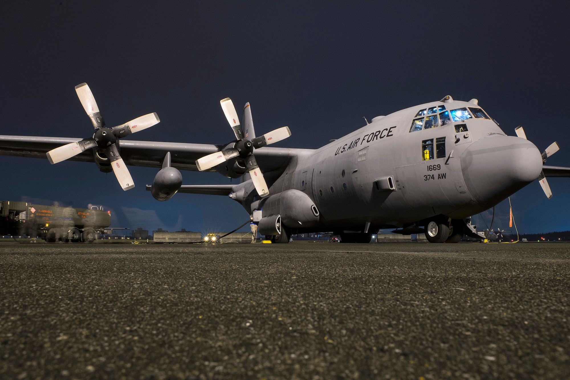Airmen with the 374th Aircraft Maintenance Squadron and 374th Logistical Readiness Squadron fuel a C-130 Hercules during Vigilant Ace 16 at Yokota Air Base, Japan, Nov. 2, 2015. Airmen prepped multiple C-130s to take part in operational flights during Vigilant Ace 16, a U.S.-Republic of Korea combined exercise aimed at enhancing operational and tactical level coordination through combined and joint combat training. The exercise also provides critical training for the Airmen of the 374th Airlift Wing to maintain peace and stability in Japan and the entire Indo-Asia Pacific region. (U.S. Air Force photo by Staff Sgt. Cody H. Ramirez/Released)