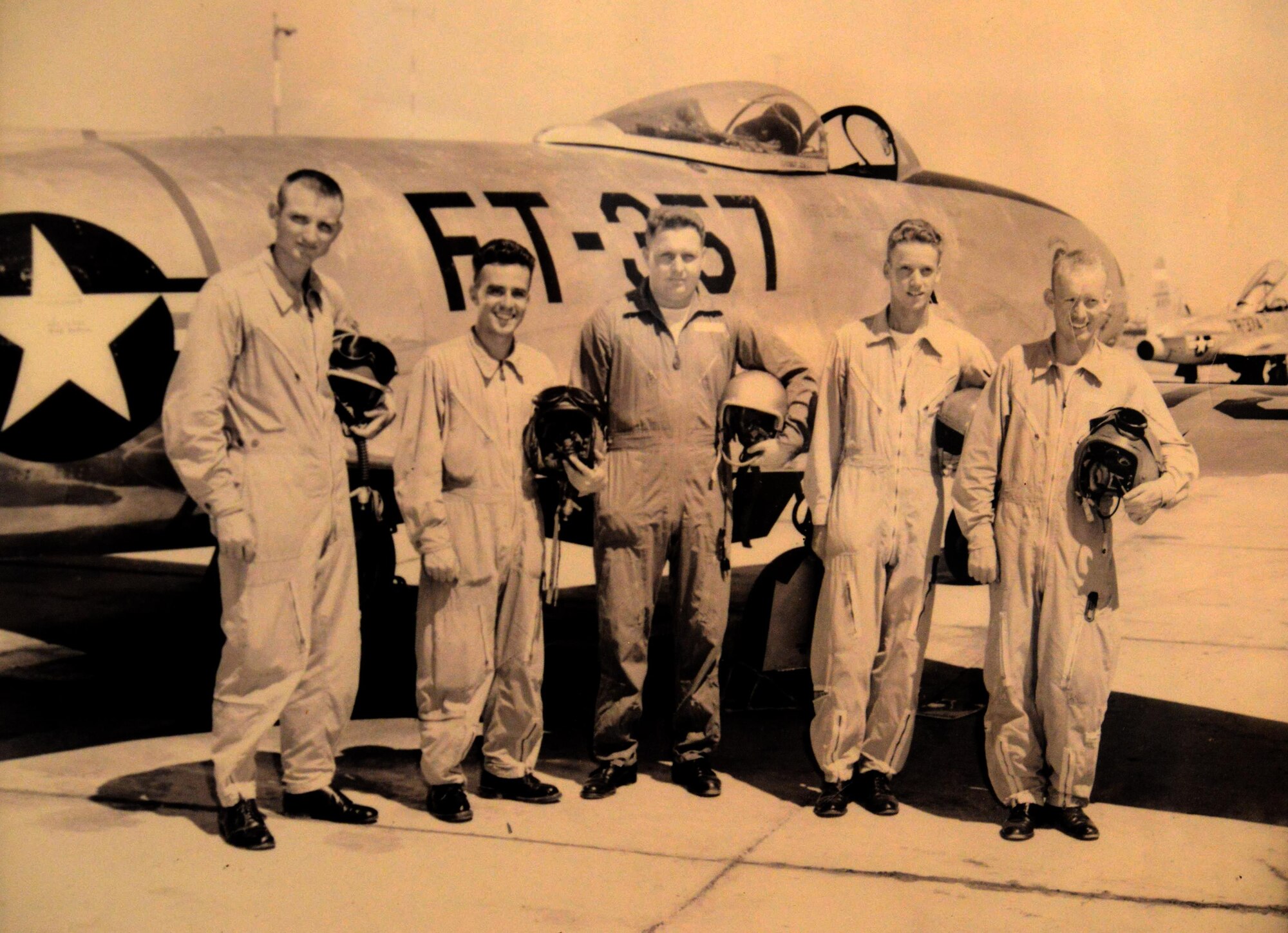 Second Lt. Alma Skousen, far right, poses in front of an aircraft in 1951 after finishing flight school at Williams Air Force Base in Chandler, Ariz. (Courtesy photo) 