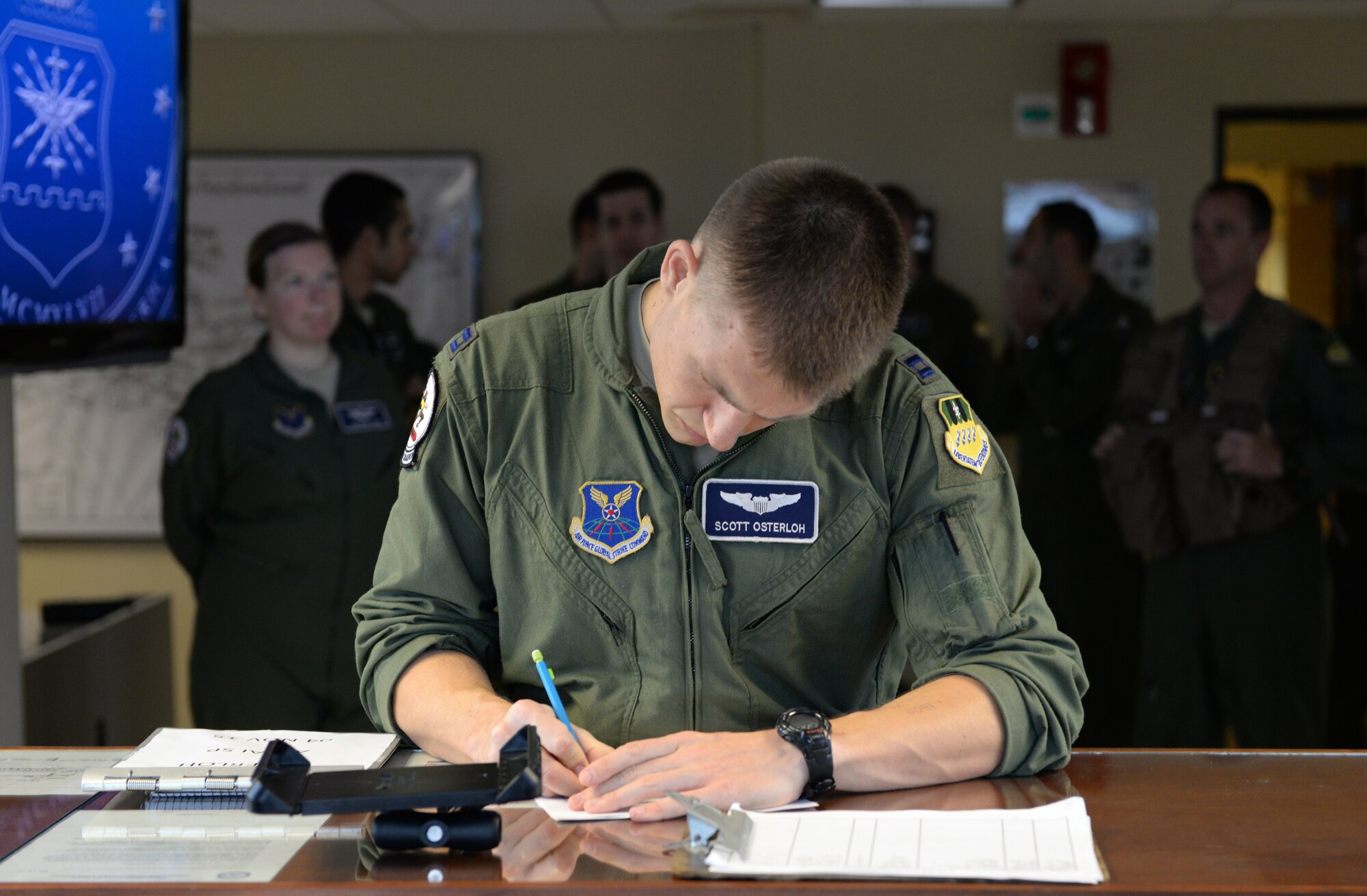 Capt. Scott Osterloh, 20th Bomb Squadron commander support staff, makes pre-flight preparations at Barksdale Air Force Base, La., Nov. 3, 2015, prior to a long-range bomber mission to the U.S. European Command area of operations in support of Trident Juncture 2015. During the non-stop sortie, which lasted approximately 26 hours, two B-52 aircrews flew from Barksdale AFB to the exercise area of operations where they executed a show-of-force in Spain, participated in a naval maritime strike scenario, and conducted a large force integration scenario in Portugal. Trident Juncture is the largest NATO exercise conducted in the past 20 years and the highest visibility NATO event planned for 2015. (U.S. Air Force photo/Airman 1st Class Curt Beach)