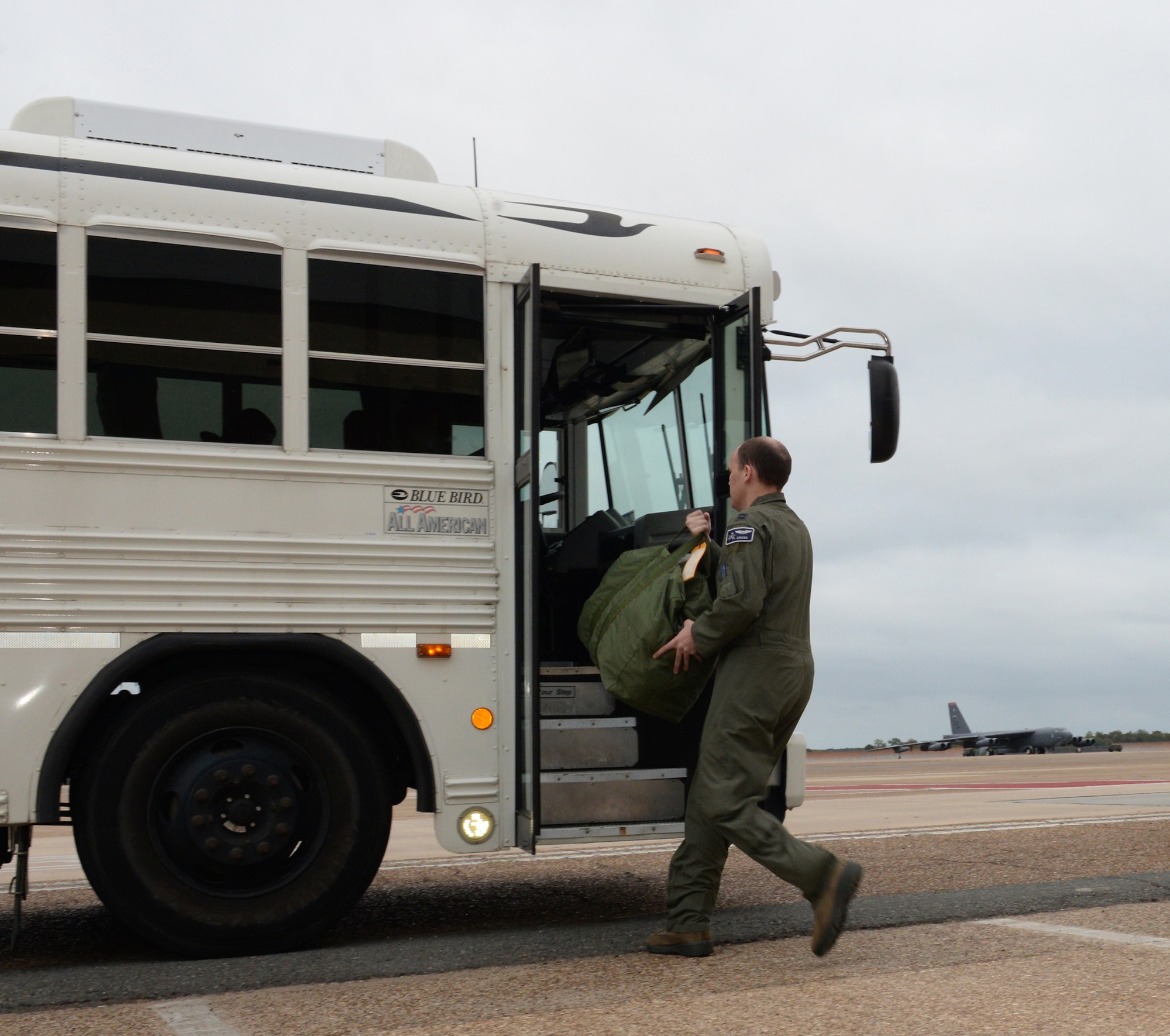 A B-52 aircrew member boards a bus to a B-52 Stratofortress at Barksdale Air Force Base, La., Nov. 3, 2015, prior to a long-range bomber mission to the U.S. European Command area of operations in support of Trident Juncture 2015. During the non-stop sortie, which lasted approximately 26 hours, two B-52 aircrews flew from Barksdale AFB to the exercise area of operations where they executed a show-of-force in Spain, participated in a naval maritime strike scenario, and conducted a large force integration scenario in Portugal. The U.S. Air Force’s bomber fleet is assigned to Air Force Global Strike Command and units regularly conduct training with and in support of U.S. Strategic Command, Geographic Combatant Commands, U.S. Allies and partners. (U.S. Air Force photo/Airman 1st Class Curt Beach)