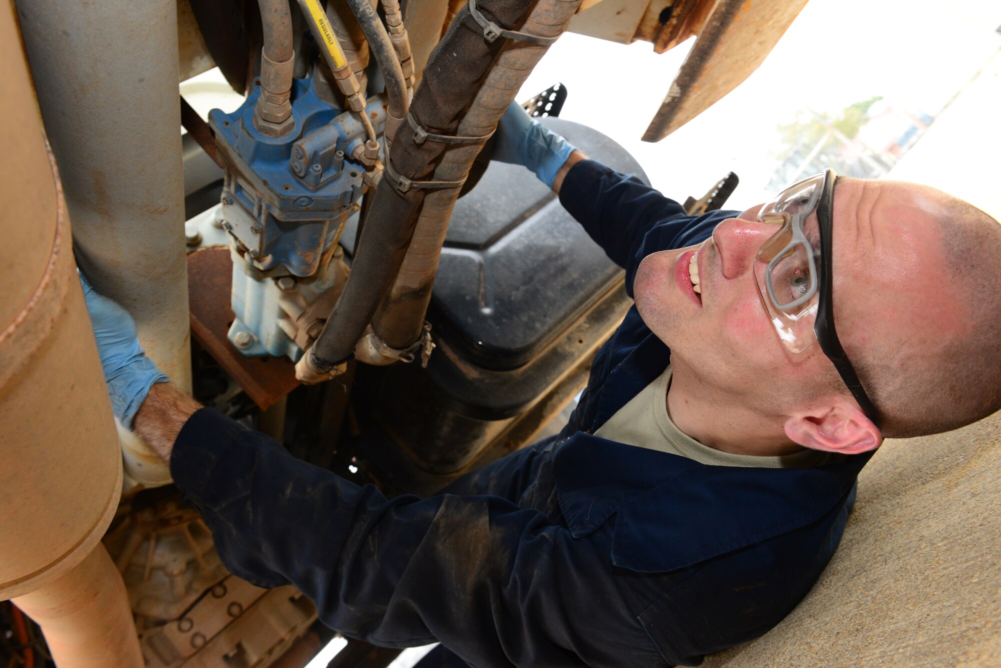 Staff Sgt. Jon Moore, 2nd Logistics Readiness Squadron vehicle maintainer, performs a routine vehicle check at Barksdale Air Force Base La., Nov. 2, 2015. Airmen rely on the use of vehicles to enable them or support their job. The 2nd LRS vehicle maintainers keep these crucial vehicles repaired and ready to serve Team Barksdale. (U.S. Air Force photo/Airman 1st Class Luke Hill)