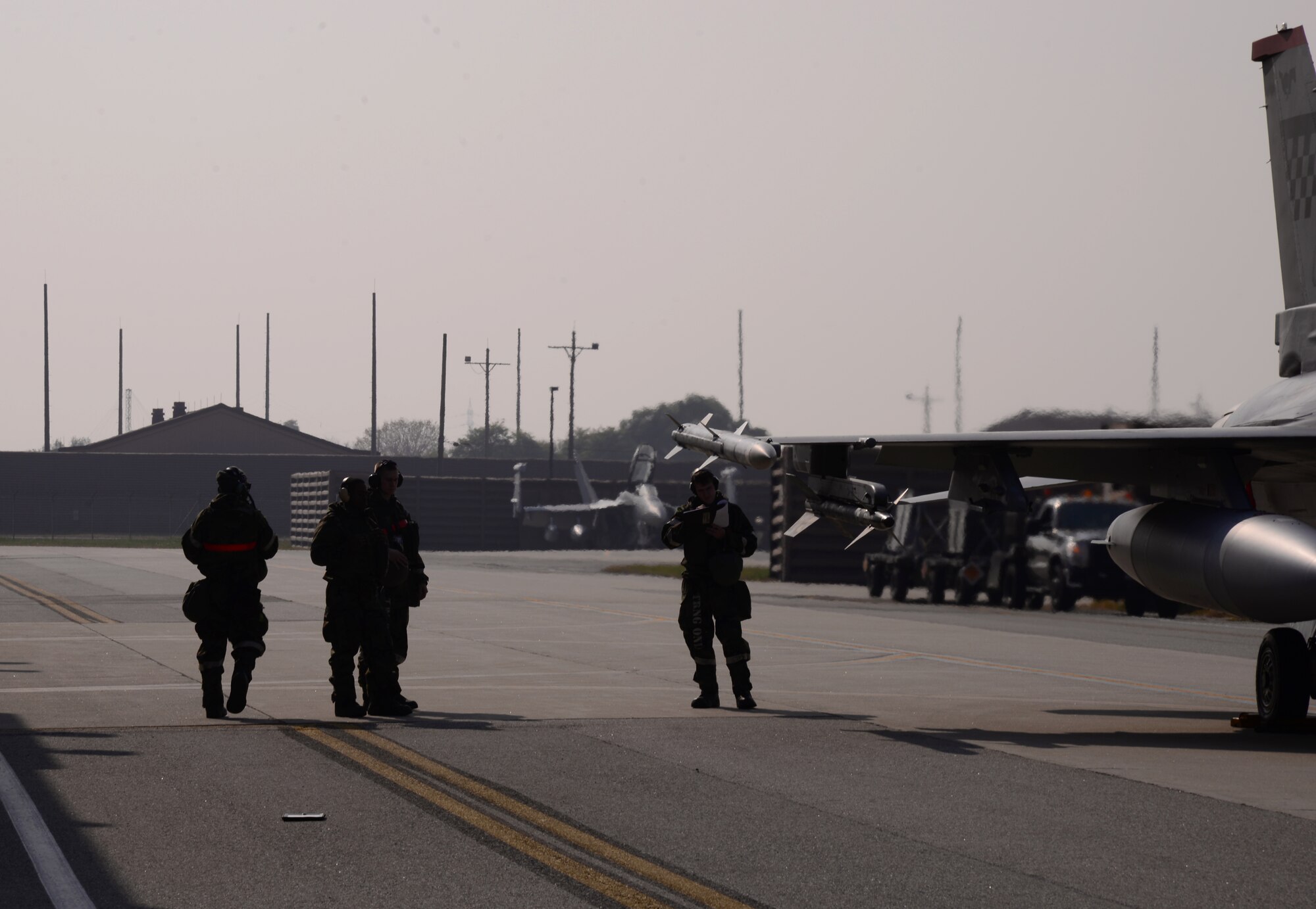 Members assigned to the 36th Aircraft Maintenance Unit perform post-flight checks on an F-16 Fighting Falcon Nov. 4, 2015, at Osan Air Base, Republic of Korea. Members of the 36th AMU are participating in the readiness exercise Vigilant Ace 16. During the large-scale exercise, Airmen are launching and recovering aircraft continuously during their 12-hour shifts. Vigilant Ace 16 is designed to enhance the interoperability of the U.S. and Republic of Korea Air Forces. (U.S. Air Force photo/Staff Sgt. Benjamin Sutton)