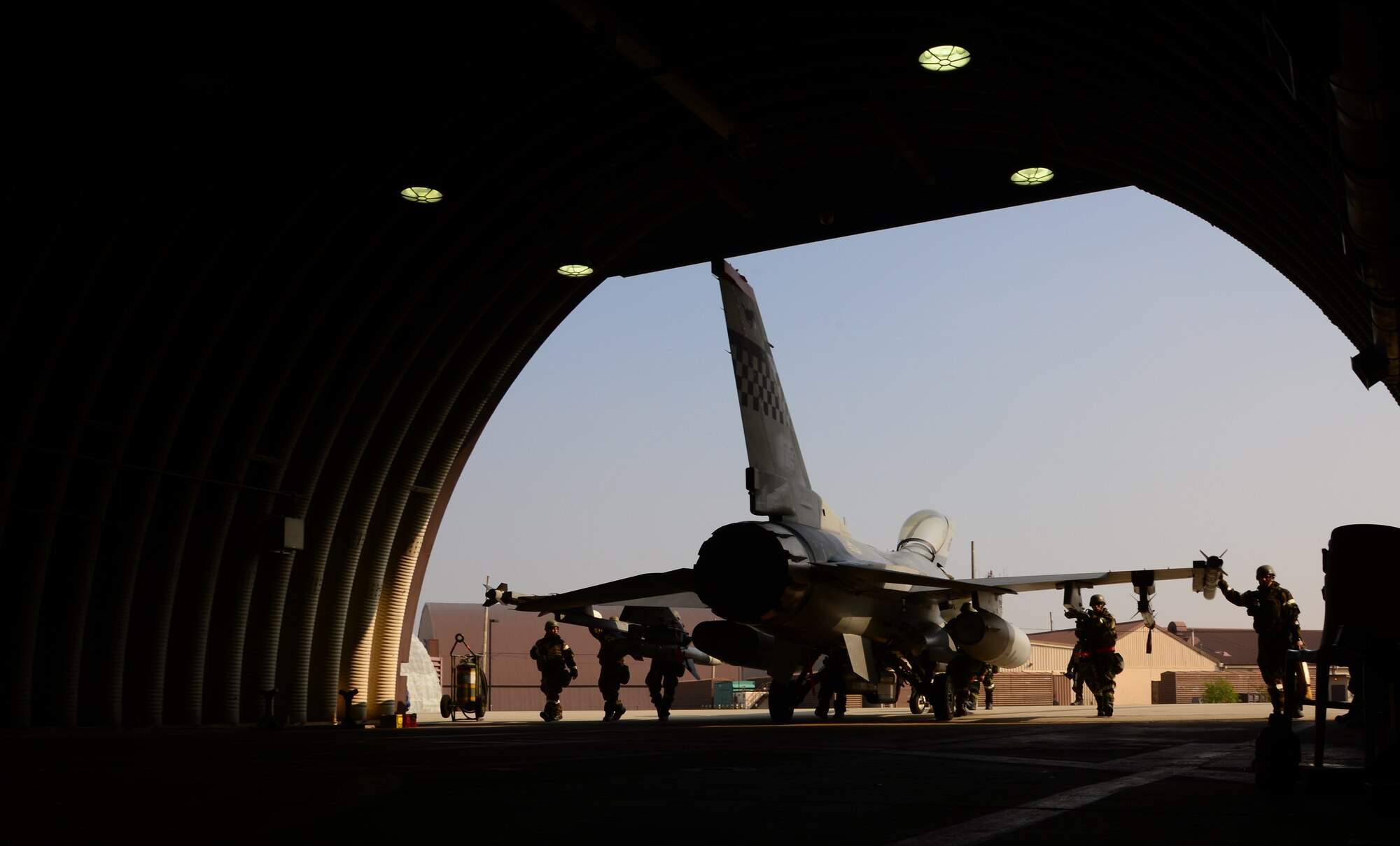 An F-16 Fighting Falcon assigned to the 36th Fighter Squadron is pushed inside a hardened facility by members of the 36th Aircraft Maintenance Unit Nov. 4, 2015, at Osan Air Base, Republic of Korea. More than eight squadrons from three separate bases across Pacific Air Forces are participating in Vigilant Ace 16. Vigilant Ace 16 is a large-scale exercise designed to enhance the interoperability of the U.S. and Republic of Korea Air Forces. (U.S. Air Force photo/Staff Sgt. Benjamin Sutton)