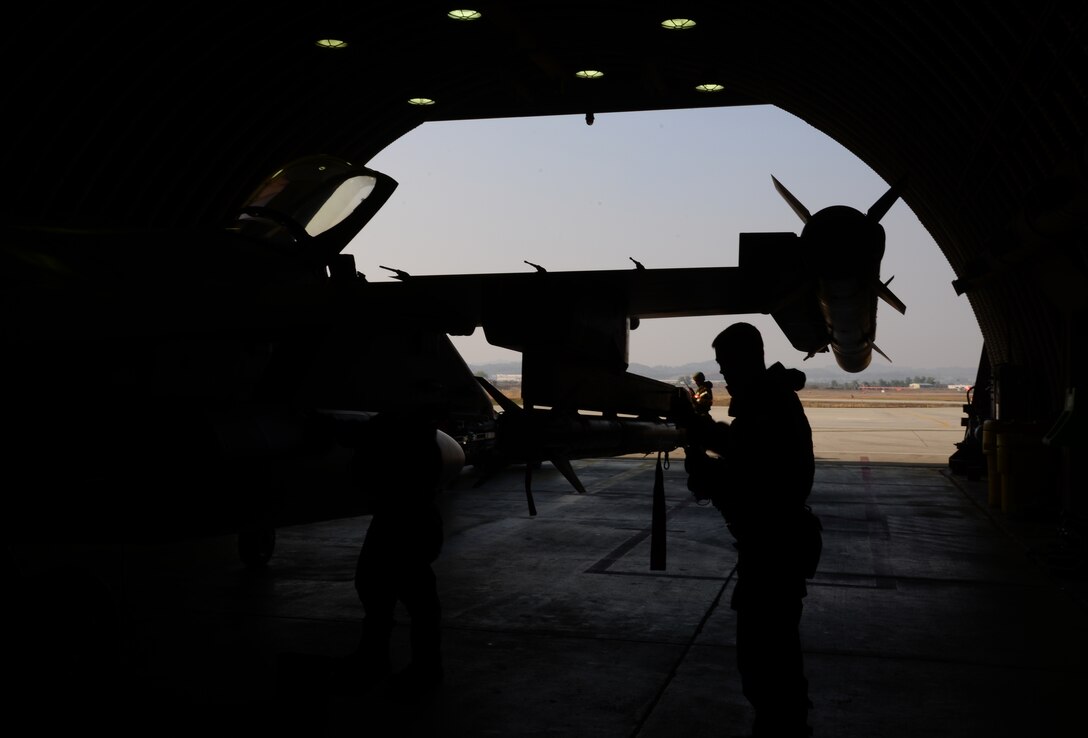 Staff Sgt. Christopher Alteri, 36th Aircraft Maintenance Unit weapons load crew team chief, performs a weapons inspection on an F-16 Fighting Falcon assigned to the 36th Fighter Squadron Nov. 4, 2015, at Osan Air Base, Republic of Korea. The 36th FS is participating in Vigilant Ace 16. Vigilant Ace 16 is a large-scale exercise designed to enhance combat capabilities and interoperability of the U.S. and Republic of Korea Air Forces. (U.S. Air Force photo/Staff Sgt. Benjamin Sutton)