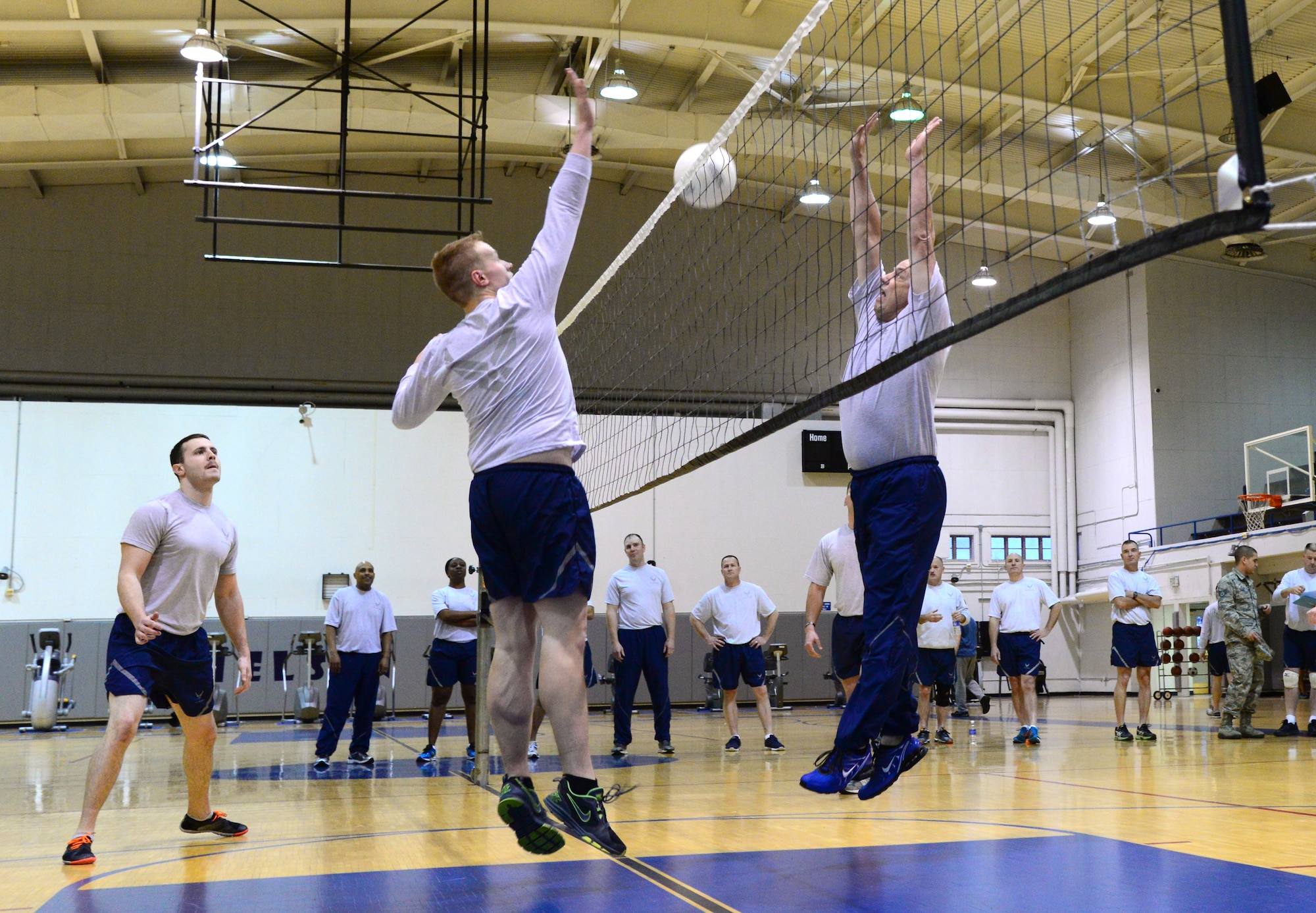 Senior Airman Trevor Auton, a Security Forces Squadron member with the Alaska Air national Guard’s 168th Refueling Wing, spikes the ball against Chief Master Sgt. Michael Brown, the 354th Fighter Wing command chief, Nov. 4, 2015, at Eielson Air Force Base, Alaska. Despite Auton’s spike on Brown, the senior noncommissioned officers took home the victory with a final score of 25-14. (U.S. Air Force photo by Airman 1st Class Cassandra Whitman/Released)