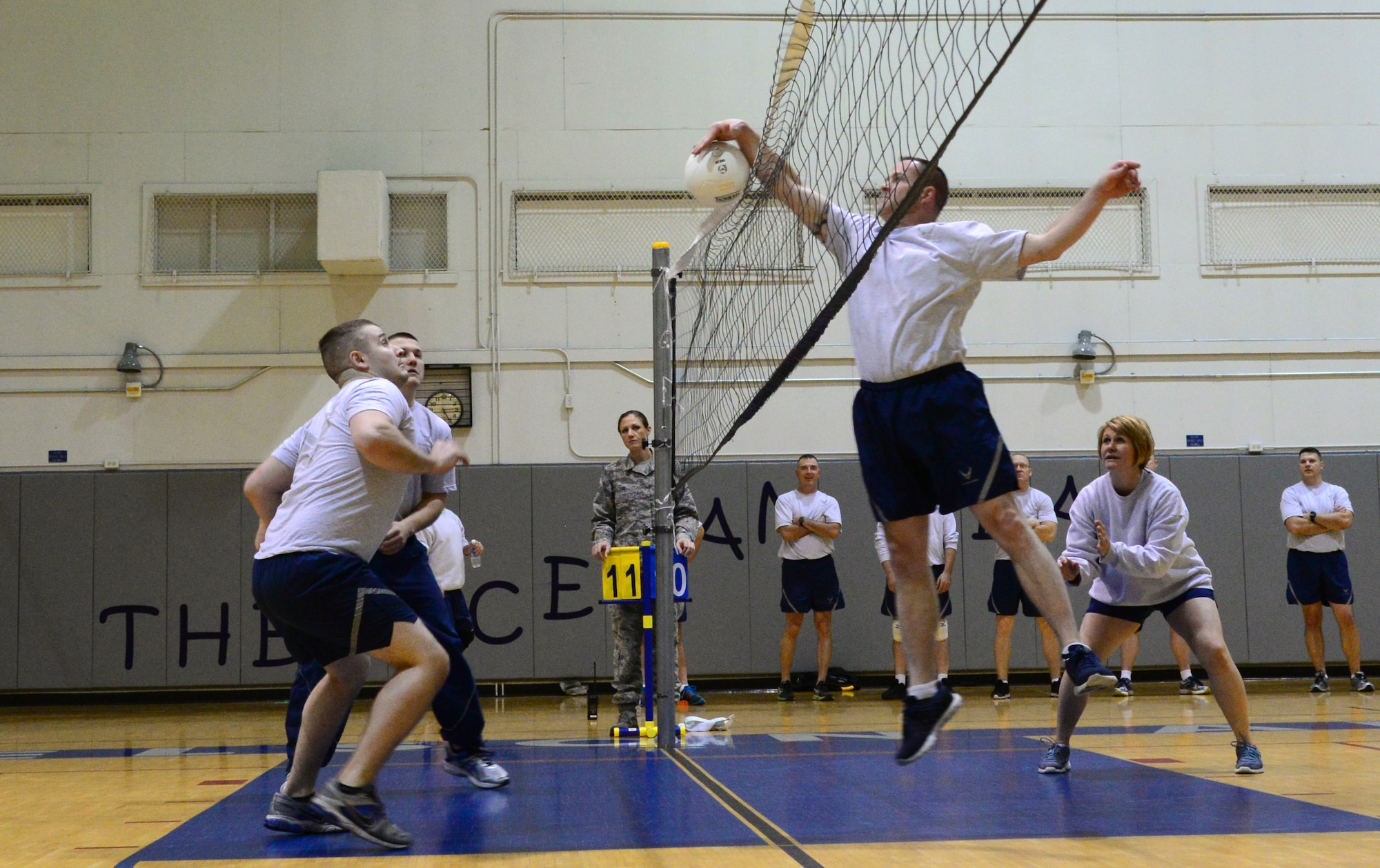 Master Sgt. Dale Felton, the 354th Communications Squadron first sergeant, spikes the ball during a volleyball matchup between Airman Leadership School students and Eielson’s chiefs and first sergeants Nov. 4, 2015, at Eielson Air Force Base, Alaska. Felton helped the senior noncommissioned officers take home a win after four games with a final score of 25-14. (U.S. Air Force photo by Airman 1st Class Cassandra Whitman/Released)