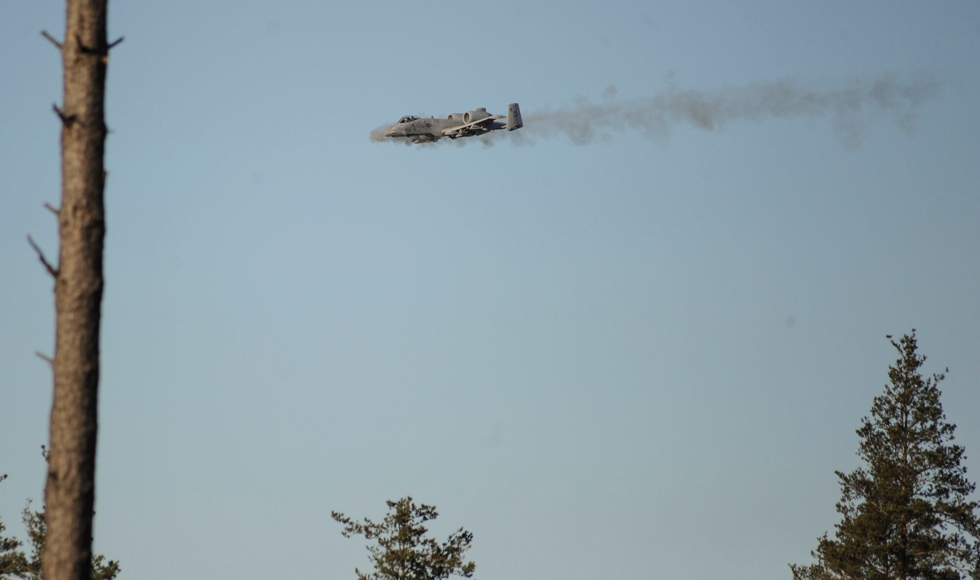 A 74th Expeditionary Fighter Squadron A-10 Thunderbolt II attack aircraft shoots the 30 mm GAU-8 Avenger Gatling gun during a close-air support training mission at Tapa training range Oct. 28, 2015, near Tapa, Estonia. During the training, A-10 Thunderbolt II attack aircraft, deployed as a Theater Security Package in support of Operation Atlantic Resolve, supported joint terminal air controllers with close air support against simulated hostile targets. (U.S. Air Force photo by Andrea Jenkins/Released)