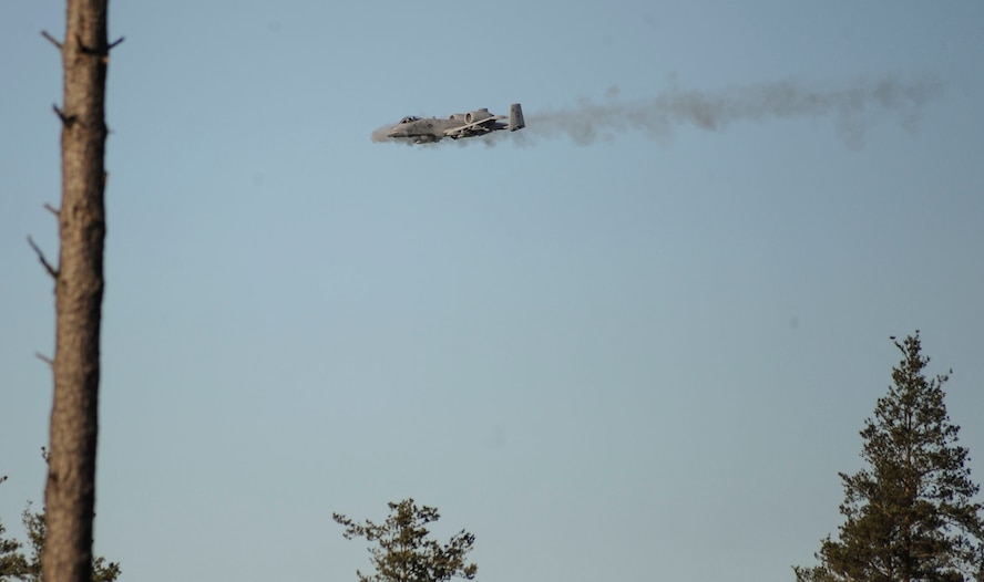 A 74th Expeditionary Fighter Squadron A-10 Thunderbolt II attack aircraft shoots the 30 mm GAU-8 Avenger Gatling gun during a close-air support training mission at Tapa training range Oct. 28, 2015, near Tapa, Estonia. During the training, A-10 Thunderbolt II attack aircraft, deployed as a Theater Security Package in support of Operation Atlantic Resolve, supported joint terminal air controllers with close air support against simulated hostile targets. (U.S. Air Force photo by Andrea Jenkins/Released)