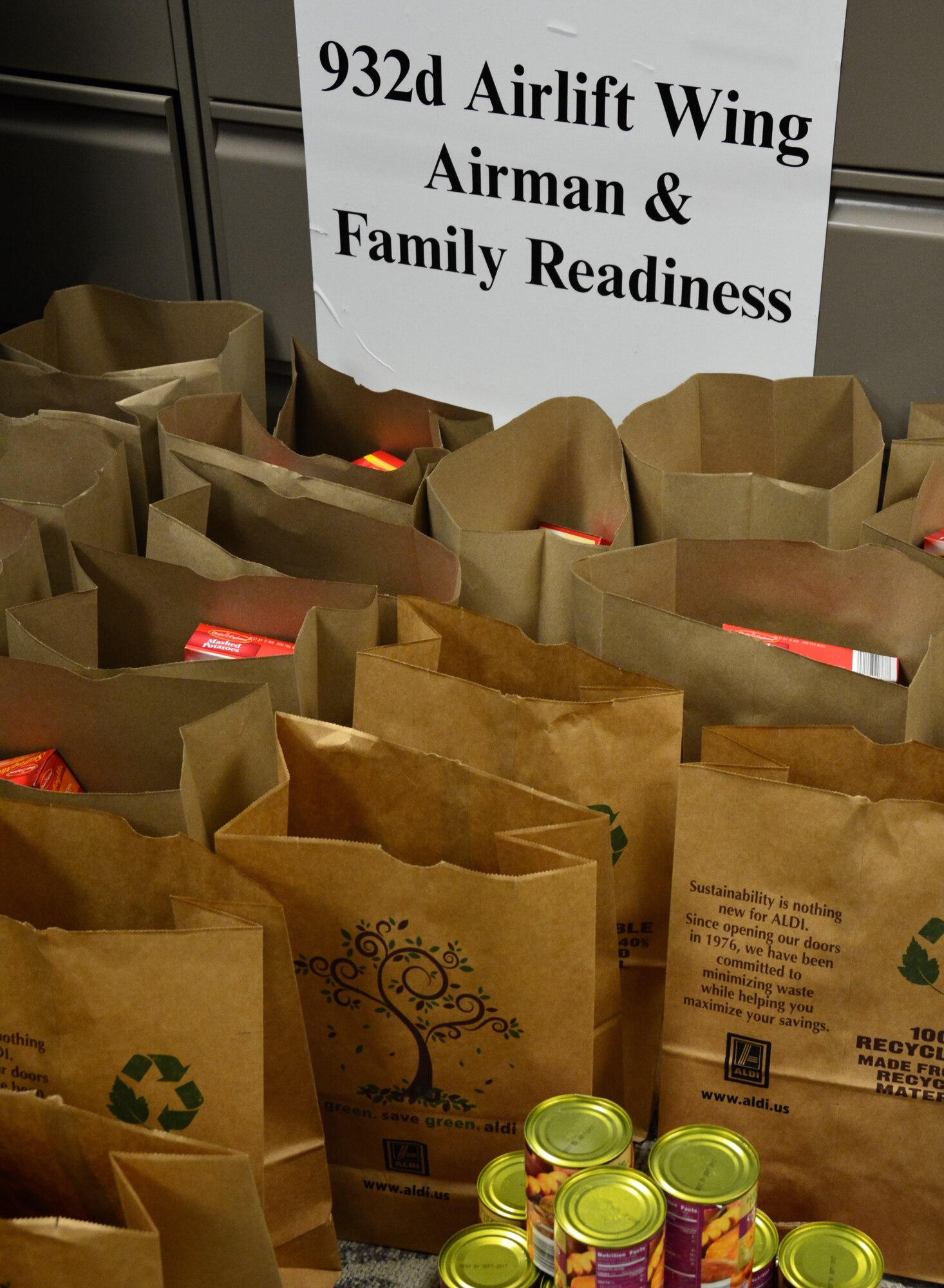 The 932nd Airlift Wing Airman & Family Readiness Center at Scott Air Force Base, Illinois gathered donations of non-perishable food items and gift cards that were used to build holiday meal baskets. The baskets, which provide everything needed to prepare a home-cooked meal, will be distributed to families who could use a little extra support during the holiday season. (U.S. Air Force photo by Tech. Sgt. Jodi Ames)