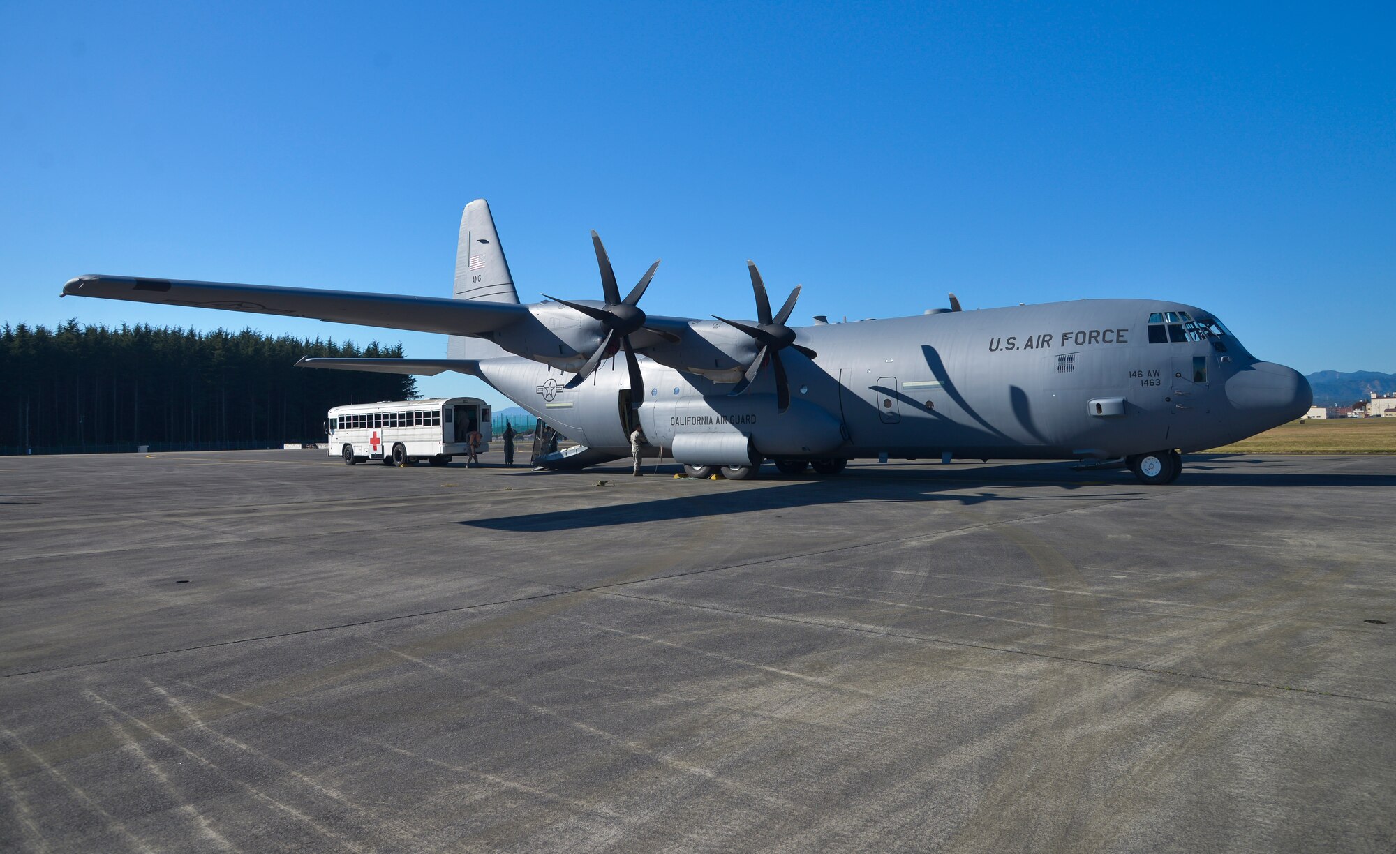 Airmen from the 374th Medical Group prep the inside of a C-130J Super Hercules, from the California Air National Guard 146th Airlift Wing, during a medical evacuation training scenario at Yokota Air Base, Japan, Nov. 4, 2015. The training consisting of litter carry scenarios, an obstacle course and high-deck patient loading platform vehicle training was held as part of a Samurai Readiness Inspection held in conjunction with the wing’s participation in Exercise VIGILANT ACE 16 to provide critical training for the Airmen of the 374th Airlift Wing to maintain peace and stability in Japan and the entire Indo-Asia Pacific region. (U.S. Air Force photo by Senior Airman David Owsianka/Released)