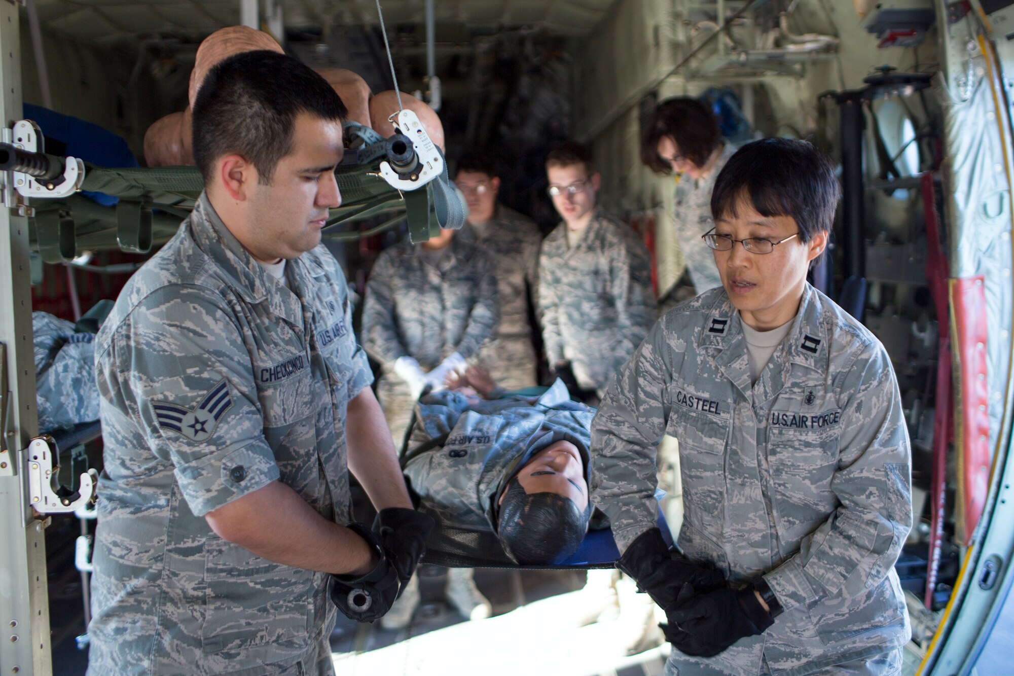 (Right to left) Capt. Elyssabeth Casteel, 374th Medical Group, and Senior Airman Edward Checkcinco, 374th Medical Operations Squadron, transport a simulated patient from a C- 130 Hercules during medical evacuation training at Yokota Air Base, Japan, Nov. 4, 2015. The training consisting of litter carry scenarios, an obstacle course and high-deck patient loading platform vehicle training was held as part of a Samurai Readiness Inspection held in conjunction with the wing’s participation in Exercise VIGILANT ACE 16 to provide critical training for the Airmen of the 374th Airlift Wing to maintain peace and stability in Japan and the entire Indo-Asia Pacific region. (U.S. Air Force photo by Osakabe Yasuo/Released)
