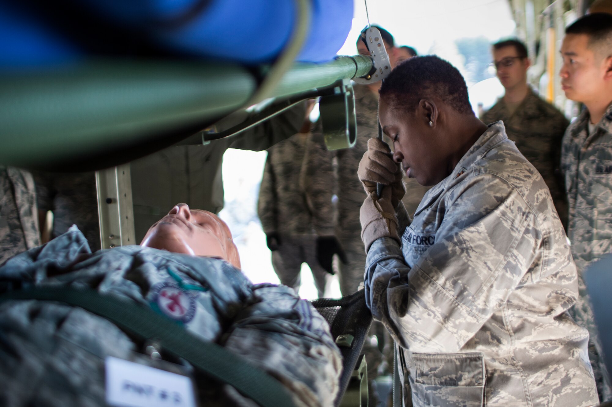 Maj. Sharon Frazier, 374th Medical Operations Squadron, concentrates before performing simulated medical evacuation training at Yokota Air Base, Japan, Nov. 4, 2015. 
As the Western Pacific mobility hub, Yokota Air Base will be a key location in the event of regional instability, and this exercise gives the installation a chance to test those capabilities in a realistic scenario.  (U.S. Air Force photo by Osakabe Yasuo/Released)
