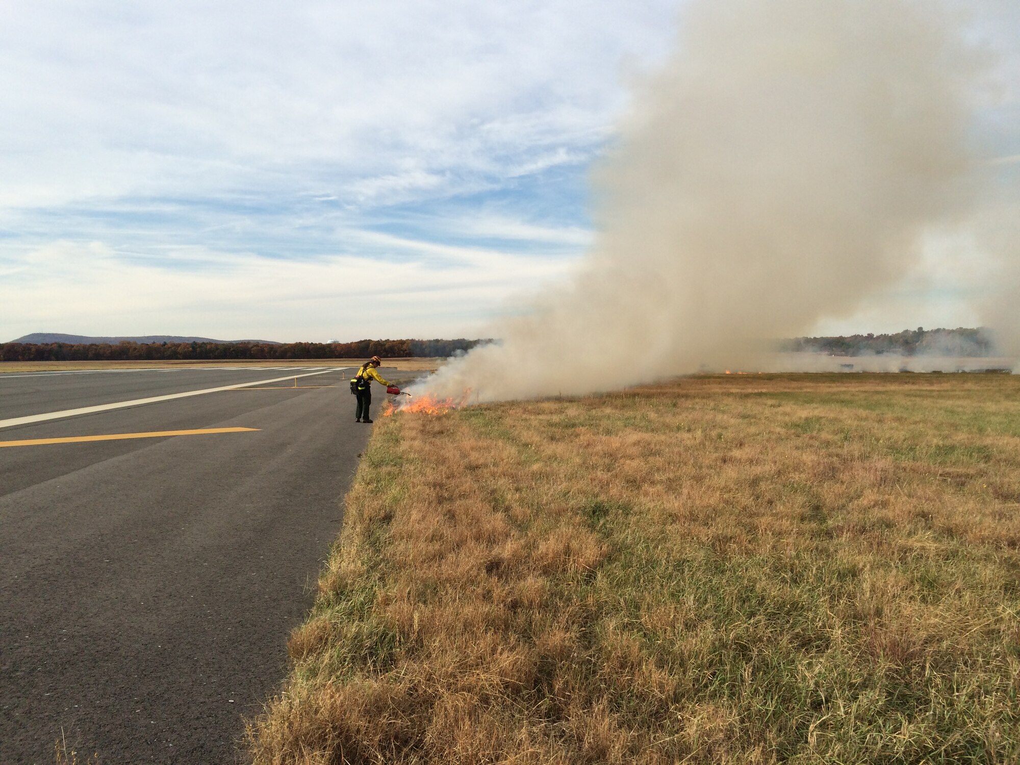 The Air Force and U.S. Forest Service joined forces last week to successfully burn 115 acres of grassland within base property at Westover Air Reserve Base, Massachusetts.  Prescribed, or controlled, burns are part of Westover’s natural resource management plan, and are used at Air Force installations across the country to maintain healthy ecosystems and prevent catastrophic damage that can occur when grass and wood fuels build up due to fire suppression. (U.S. Air Force Photo/Stephen Najjar/Released)