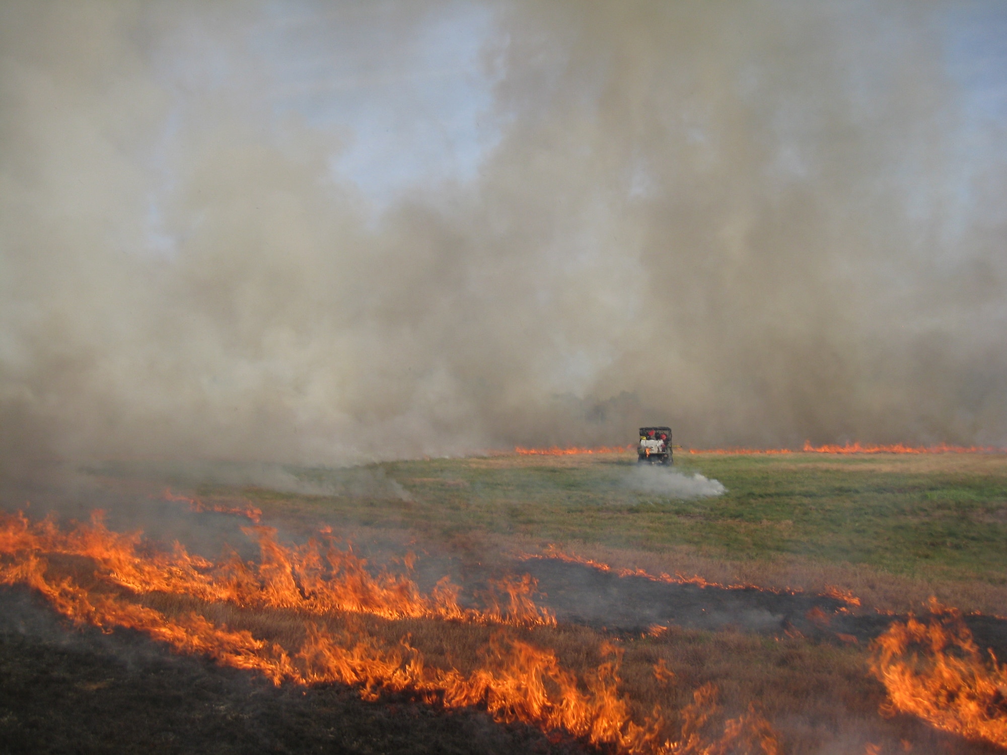 The Air Force and U.S. Forest Service joined forces last week to successfully burn 115 acres of grassland within base property at Westover Air Reserve Base, Massachusetts.  Prescribed, or controlled, burns are part of Westover’s natural resource management plan, and are used at Air Force installations across the country to maintain healthy ecosystems and prevent catastrophic damage that can occur when grass and wood fuels build up due to fire suppression. (U.S. Air Force Photo/Stephen Najjar/Released)