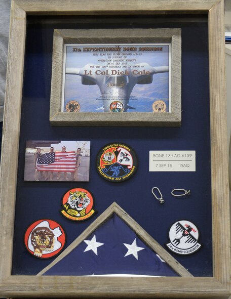 A shadowbox was constructed at Ellsworth Air Force Base, S.D., Oct. 30, 2015, to be presented to retired Lt. Col. Dick Cole, one of two surviving Doolittle Raiders, Nov. 5 at the Pentagon in Arlington, Va. The box holds memorabilia from Ellsworth, along with a flag that was flown during a combat mission on Cole’s 100th birthday. (U.S. Air Force photo by Senior Airman Rebecca Imwalle/Released)