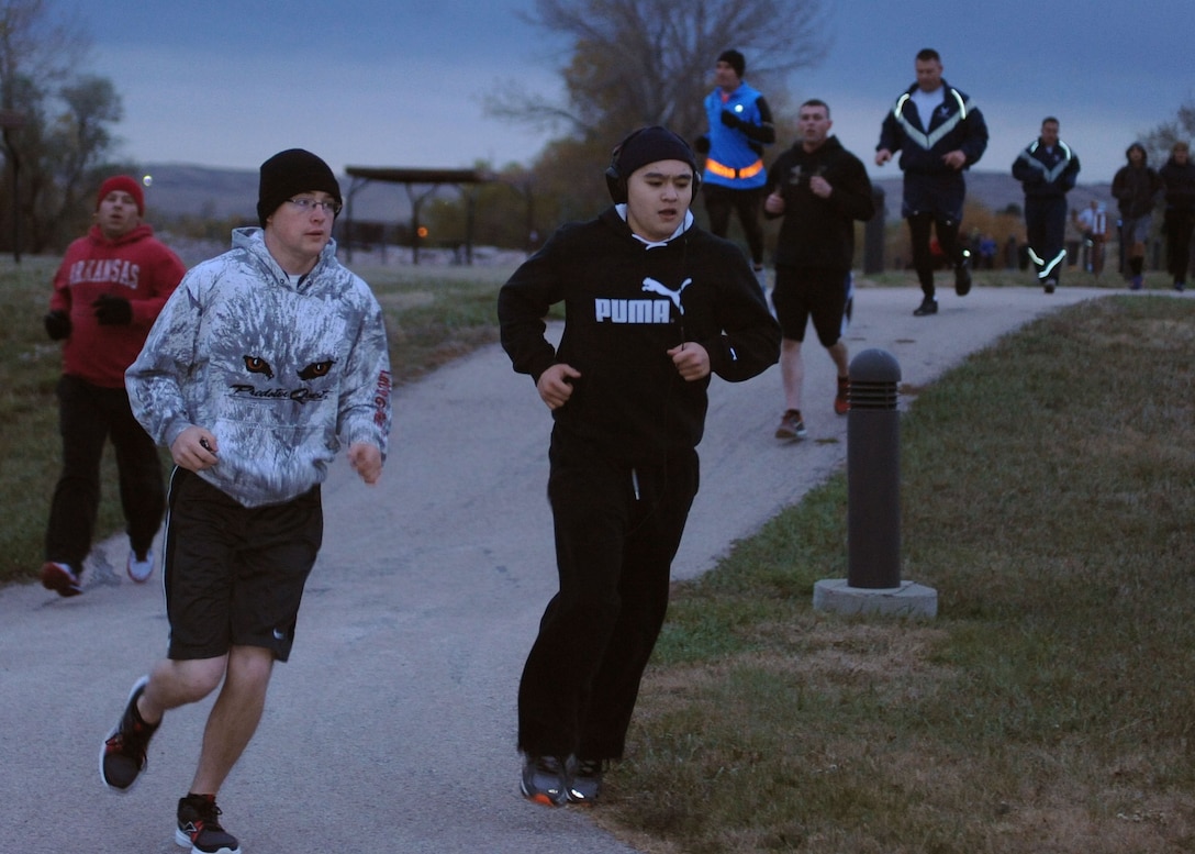 Airmen participate in a Zombie 5k run at Ellsworth Air Force Base, S.D., Oct. 30, 2015. Participating in physical activities and maintaining healthy nutrition habits help Airmen stay fit to fight. (U.S. Air Force photo by Airman Sadie Colbert/Released)