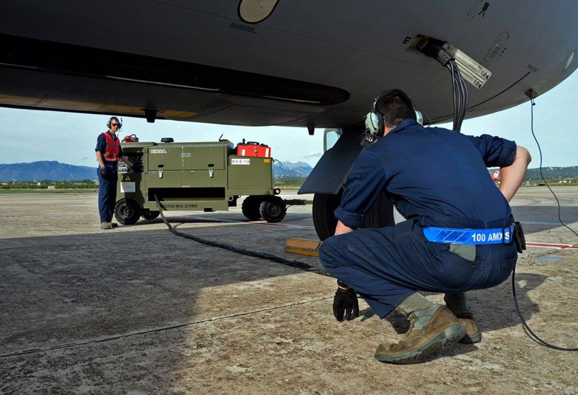 U.S. Air Force Staff Sgt. Austin Brookshire, right, 100th Aircraft Maintenance Squadron crew chief, and U.S. Air Force Senior Airman Joshua Kearney, 100th AMXS crew chief, prepare for an engine start on a KC-135 Stratotanker Oct. 29, 2015, at Son San Juan Air Base, Spain. Airmen from the 100th AMXS performed regular maintenance on the KC-135 Stratotanker during Exercise Trident Juncture. (U.S. Air Force photo by Senior Airman Christine Halan/Released)