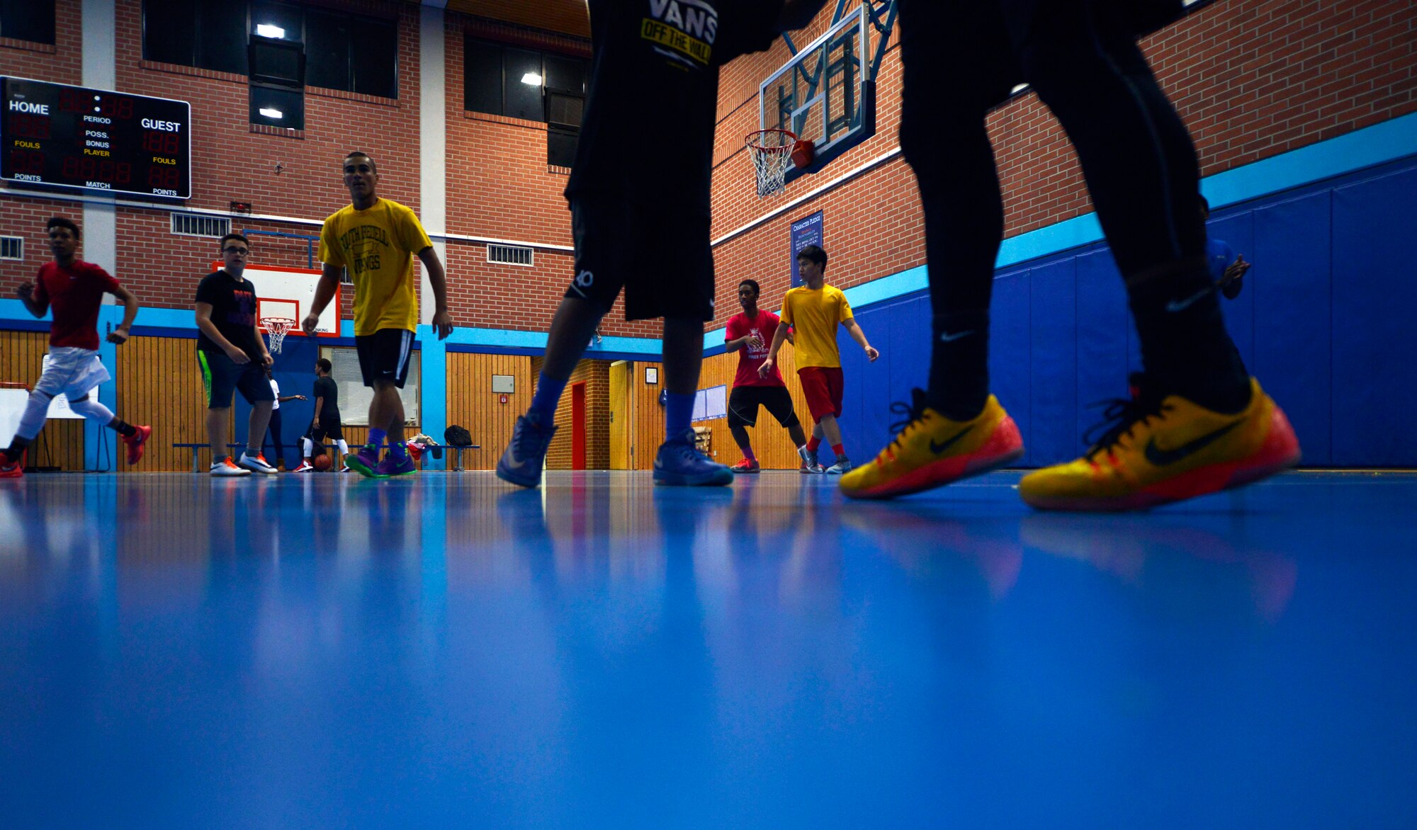 Participants in the Work Accountability Responsibility Respect Integrity Opportunity Represent (WARRIOR) Program play a basketball game Oct. 30, 2015, at Ramstein Air Base, Germany. The WARRIOR Program uses basketball and 14 targeted lessons to bring young men together and reinforce character, leadership and positive behavior.  Lesson topics include self-esteem, fatherhood and family, relationships with girls and responses to authority. (U.S. Air Force photo/Staff Sgt. Sharida Jackson)