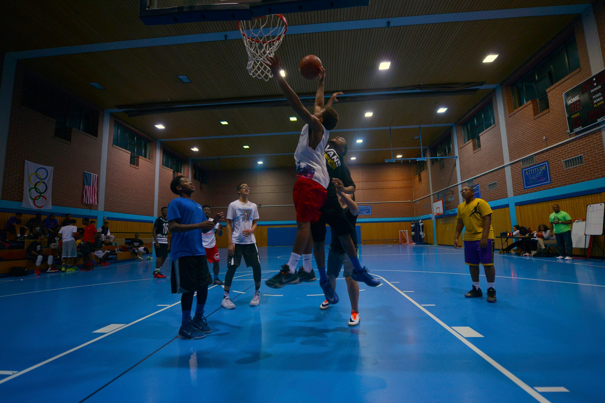 Participants in the Work Accountability Responsibility Respect Integrity Opportunity Represent (WARRIOR) Program play a basketball game Oct. 30, 2015, at Ramstein Air Base, Germany. The WARRIOR Program uses basketball as a tool to bring young men together and is a targeted effort to reinforce character, leadership and positive behavior. (U.S. Air Force photo/Staff Sgt. Sharida Jackson)