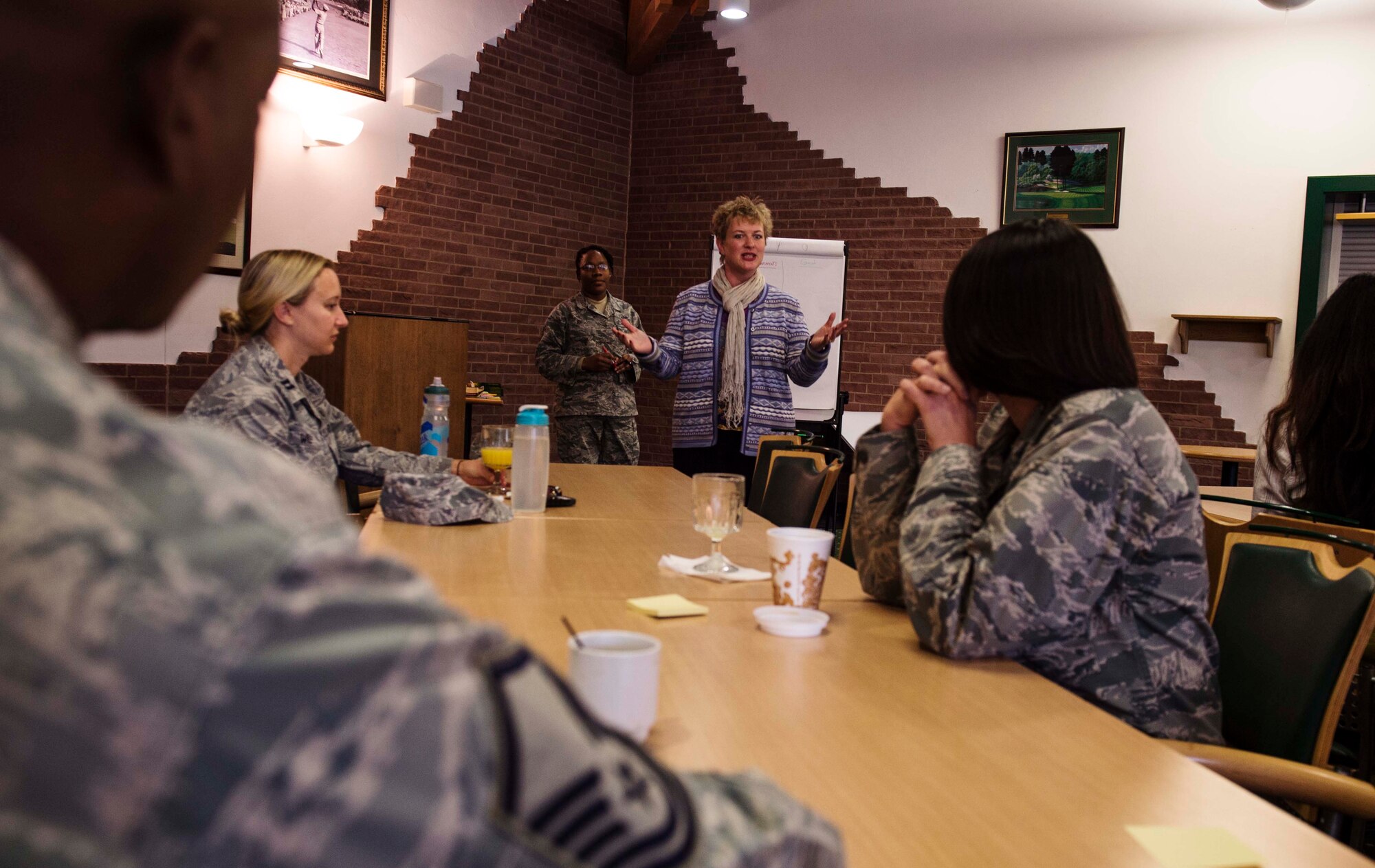 Barbara Cox, Family Advocacy outreach manager, leads a group discussion as service members get the chance to voice their opinion about base programs during the Caring for People Forum at Ramstein Air Base, Germany, Nov. 4, 2015. The forum was aimed to bring Airmen, civilian employees and family members together to collaborate in working groups to identify problems and propose solutions to Air Force policies and services. (U.S. Air Force photo/Staff Sgt. Sara Keller)