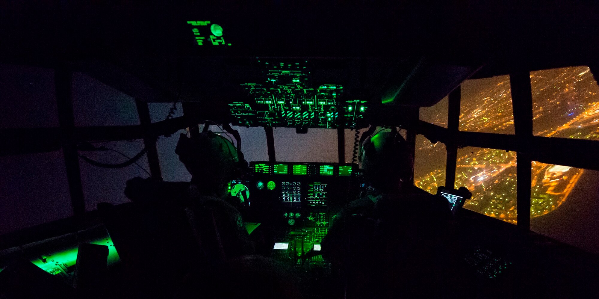 U.S. Air Force 37th Airlift Squadron pilots fly a C-130J Super Hercules during Aviation Detachment 16-1, Oct. 30, 2015, above Powidz Air Base, Poland. The flying training deployment was a bilateral training opportunity with the Polish air force in support of Operation Atlantic Resolve. As part of the deployment pilots and loadmasters from the 37th AS performed maneuvers, airdrops and unimproved landings at night. (U.S. Air Force photo/Senior Airman Damon Kasberg)