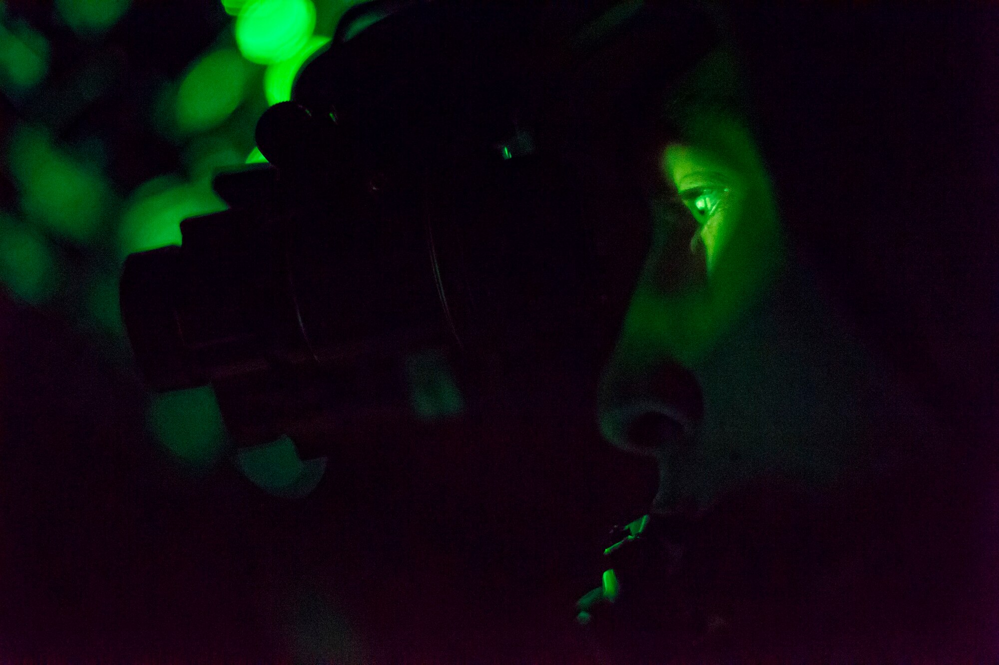 A U.S. Air Force C-130J Super Hercules pilot flies while wearing night-vision goggles during Aviation Detachment 16-1, Oct. 28, 2015 above Powidz, Poland. As part of the flying training deployment pilots flew in low-light situations to maintain proficiency, which they’re unable to do at home station due to flight restrictions. (U.S. Air Force photo/Senior Airman Damon Kasberg)