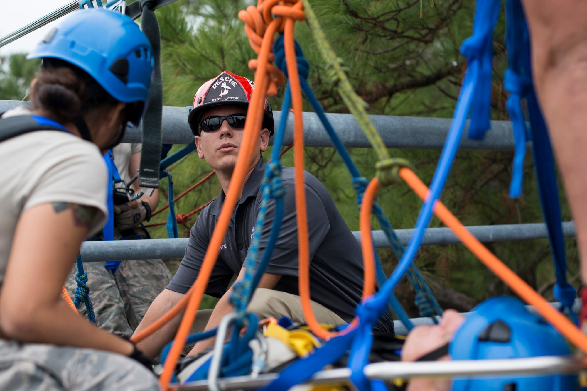 Staff Sgt. Alexander Rodriguez, Department of Defense Fire Academy rescue instructor, goes over safety protocol and confined space rescue techniques to the 11th Civil Engineer firefighters at the Joint Base Andrews, Md., Fire Department Training Area, Nov. 2, 2015. The DOD Rescue Technical Course only has six mobile training team trips in which the instructor comes to the host installation to train up to 12 fire department personnel. (U.S. Air Force photo by Airman 1st Class Philip Bryant/Released)