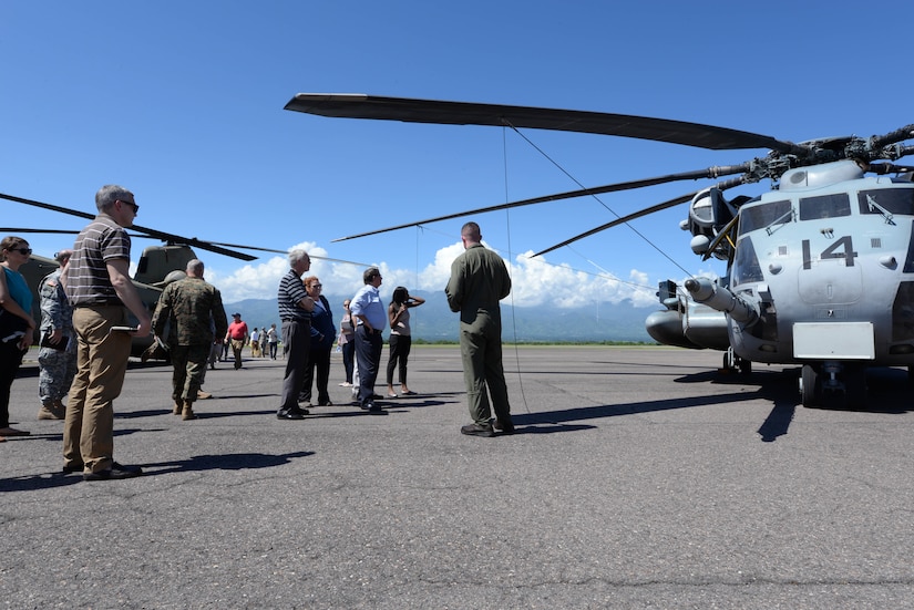 U.S. Marine Capt. Christopher Doyle, Special Purpose Marine Air-Ground Task Force-Southern Command pilot, provides a brief on the capabilities of the MH-53 Pave Low helicopter to members of Congress on Soto Cano Air Base, Honduras, Nov. 1, 2015, during a Congressional Delegation visit. The SPMAGTF-SC is one of several units that provided the delegation with insights into the missions and operations conducted out of Soto Cano. (U.S. Air Force photo by Senior Airman Westin Warburton/Released)