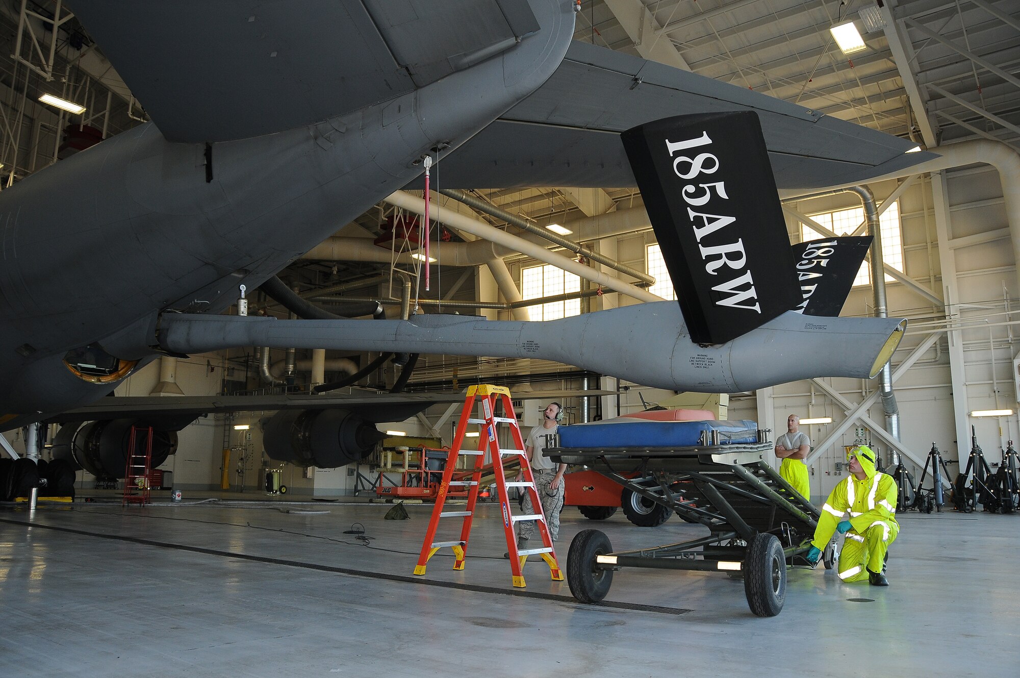 U.S. Air National Guard Master Sgt. Travis Metcalf, Airman 1st Class Matt Niles and Senior Airman Chris Countryman all crew chiefs with the 185th Air Refueling Wing, Iowa Air National Guard, lower the boom on an Air Force KC-135 Stratotanker, November 3, 2015. The boom is being lowered while in the fuel cell hangar in Sioux City, Iowa in preparation for washing as part of a scheduled 180 day aircraft wash.

(U.S. Air National Guard photo by: Master Sgt. Vincent De Groot 185ARW PA/released)
