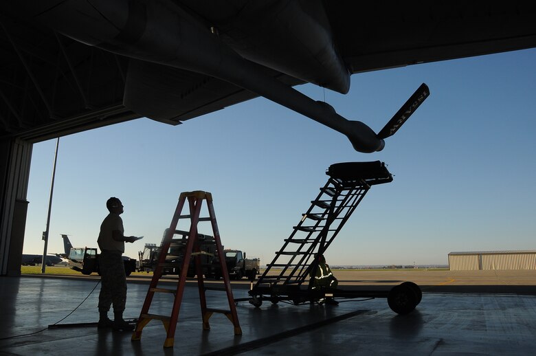 U.S. Air National Guard Master Sgt. Travis Metcalf, a crew chief with the 185th Air Refueling Wing, Iowa Air National Guard, oversees lowering of the boom on an Air Force KC-135 Stratotanker, November 3, 2015. The boom is being lowered while in the fuel cell hangar in Sioux City, Iowa in preparation for washing as part of a scheduled 180 day aircraft wash.
(U.S. Air National Guard photo by: Master Sgt. Vincent De Groot 185ARW PA/released)
