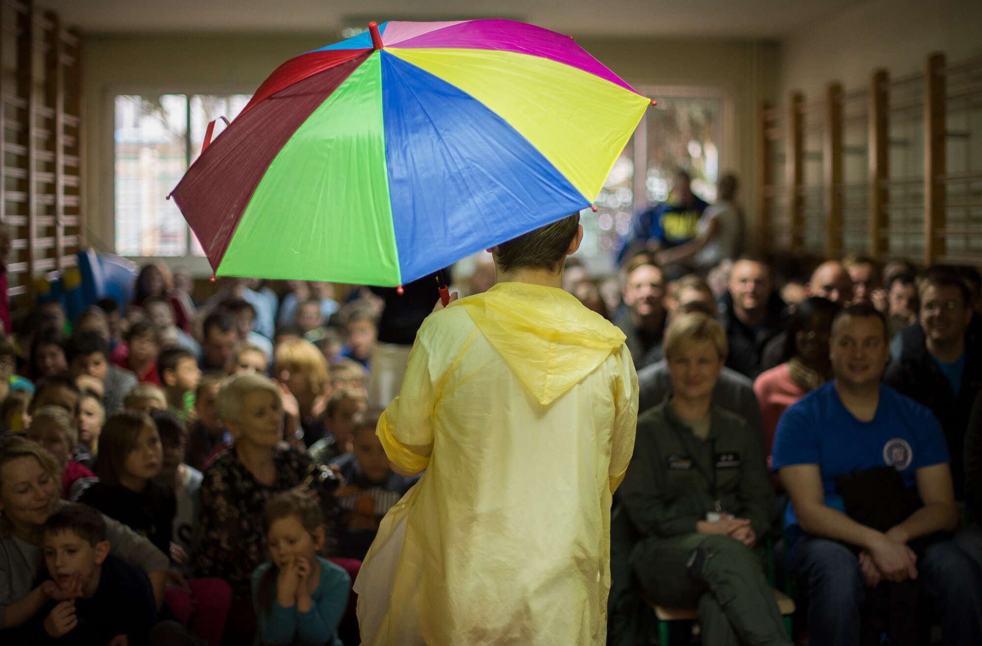 A student performs to 'Singn' in the Rain' for U.S. and Polish Airmen during a community outreach event at a Polish special needs school Oct. 30, 2015, at Września, Poland. The Airmen were deployed to Poland to participate in Aviation Detachment 16-1, where they worked to complete training requirements and build interoperability with the Polish air force. This marked the second visit to the school, in a growing relationship with the local community. (U.S. Air Force photo/Senior Airman Damon Kasberg)