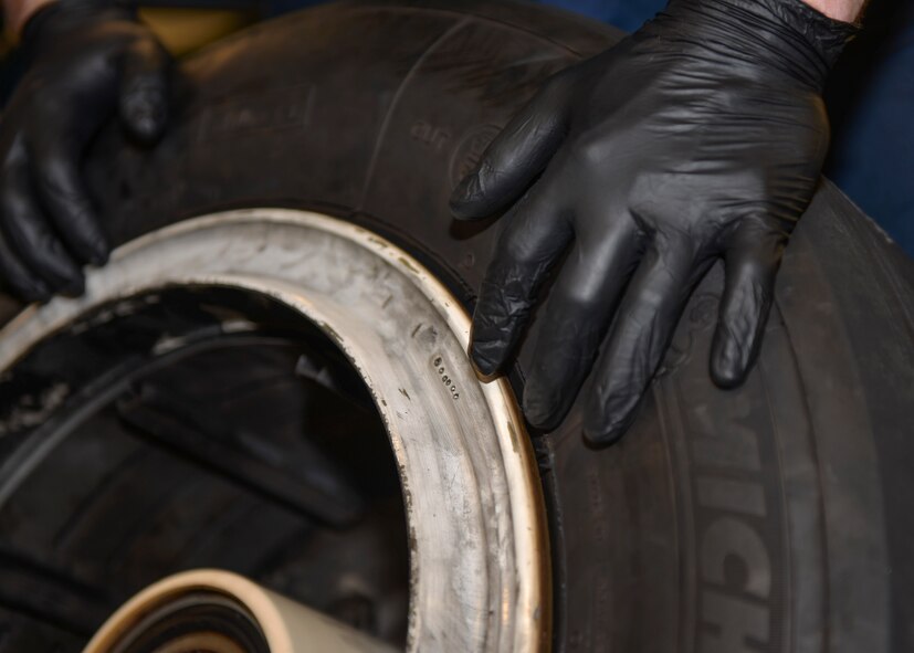 Senior Airmen Kenneth Chandler, 33rd Maintenance Squadron crew chief, counts the metal markings on a tire of an F-35A Lightning II at Eglin Air Force Base, Fla., Nov. 4, 2015.  Each marking reflects a completed inspection of the tire to track its serviceability. (U.S. Air Force Photo/Senior Airman Andrea Posey)