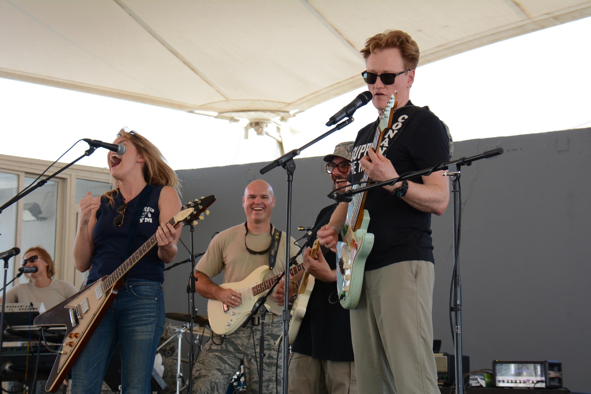 Late night talk show host and comedian, Conan O’Brien and singer and songwriter, Grace Potter, rehearse with the U.S. Air Force's Central Command Band Nov. 3 at Al Udeid Air Base, Qatar. O'Brien and Potter entertained deployed service member for nearly two hours during a variety show at the base. They both said they were honored to take part in the event and thanked all service members for what they do to defend America’s freedom. (U.S. Air Force photo by Tech. Sgt. James Hodgman)