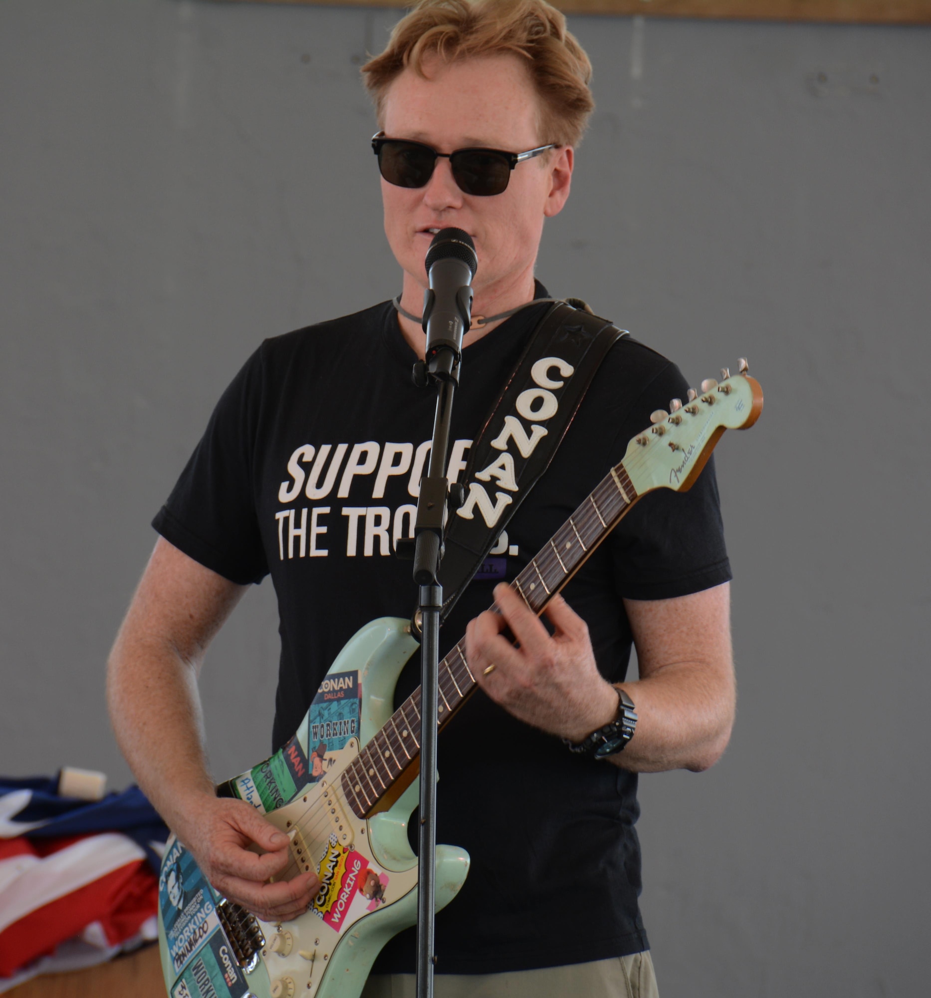 Late night talk show host and comedian, Conan O’Brien, plays his guitar during a rehearsal for a variety show at Al Udeid Air Base, Qatar Nov. 3. O’Brien visited AUAB to entertain deployed service members. He said he was honored to perform for America’s warriors and thanked all service members for what they do to defend America’s freedom. (U.S. Air Force photo by Tech. Sgt. James Hodgman)