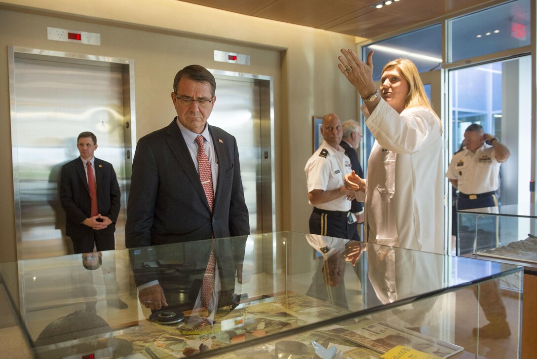 Defense Secretary Ash Carter, left, views many of the artifacts on display at the Defense POW/MIA Accounting Agency learning center as he tours the facility on Joint Base Pearl Harbor–Hickam, Honolulu, Nov. 5, 2015. DoD photo by Air Force Senior Master Sgt. Adrian Cadiz