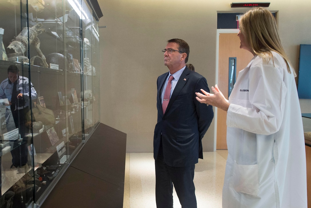 Defense Secretary Ash Carter, left, views many of the artifacts on display at the Defense POW/MIA Accounting Agency learning center as he tours the facility on Joint Base Pearl Harbor–Hickam, Honolulu, Nov. 5, 2015. DoD photo by Air Force Senior Master Sgt. Adrian Cadiz