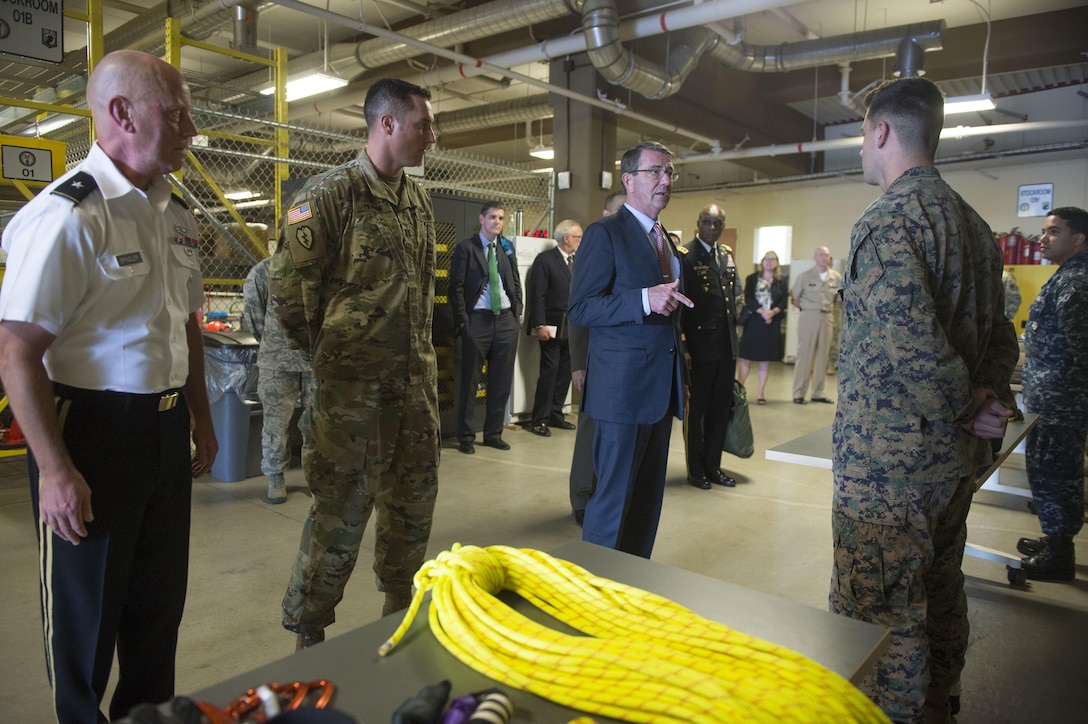 U.S. Defense Secretary Ash Carter speaks with members of the recovery team from the Defense POW/MIA Accounting Agency and views some of the equipment they use as he tours the facility on Joint Base Pearl Harbor–Hickam, Honolulu, Nov. 5, 2015. DoD photo by Air Force Senior Master Sgt. Adrian Cadiz