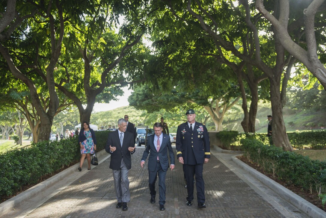 Defense Secretary Ash Carter, center, walks with Army Maj. Gen. Eric P. Wendt, chief of staff of the U.S. Pacific Command, and Jim Horton, director of the National Memorial Cemetery of the Pacific, as they enter the cemetery in Honolulu, Nov. 5, 2015. Carter visited the cemetery to lay a wreath to pay his respects to the fallen. DoD photo by Air Force Senior Master Sgt. Adrian Cadiz