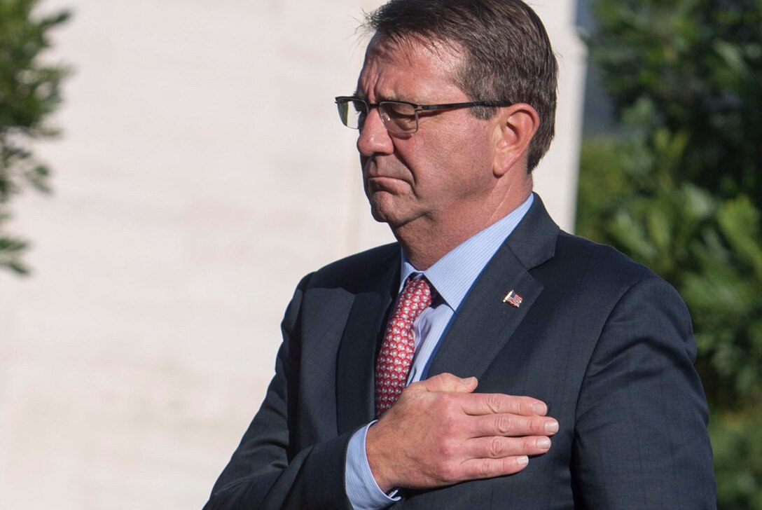 Defense Secretary Ash Carter places his hand over his heart after laying a wreath to pay his respects to the fallen at the National Memorial Cemetery of the Pacific in Honolulu, Nov. 5, 2015. DoD photo by Air Force Senior Master Sgt. Adrian Cadiz