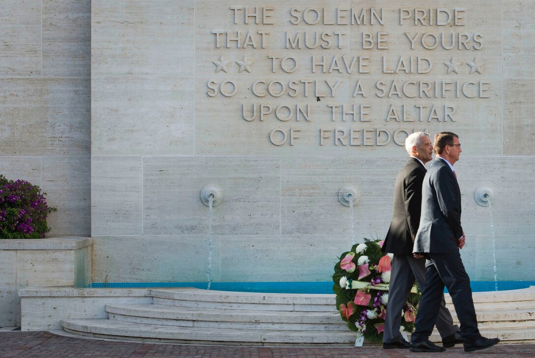 Defense Secretary Ash Carter walks with Jim Horton, director of the National Memorial Cemetery of the Pacific, as Horton gives him a historical overview of the cemetery in Honolulu, Nov. 5, 2015. DoD photo by Air Force Senior Master Sgt. Adrian Cadiz